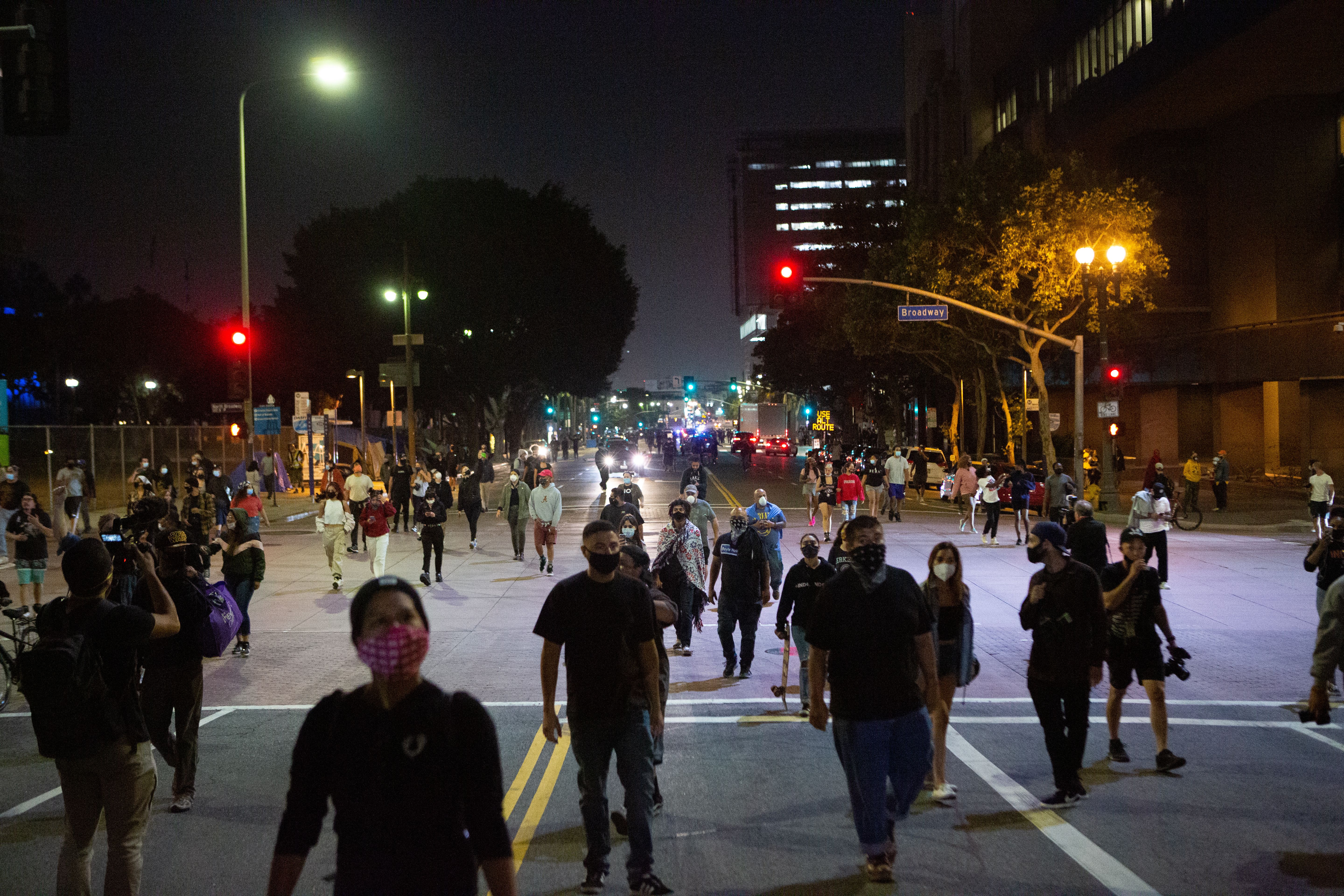 Protestors walk in downtown Los Angeles after a demonstration on May 27, 2020. 
