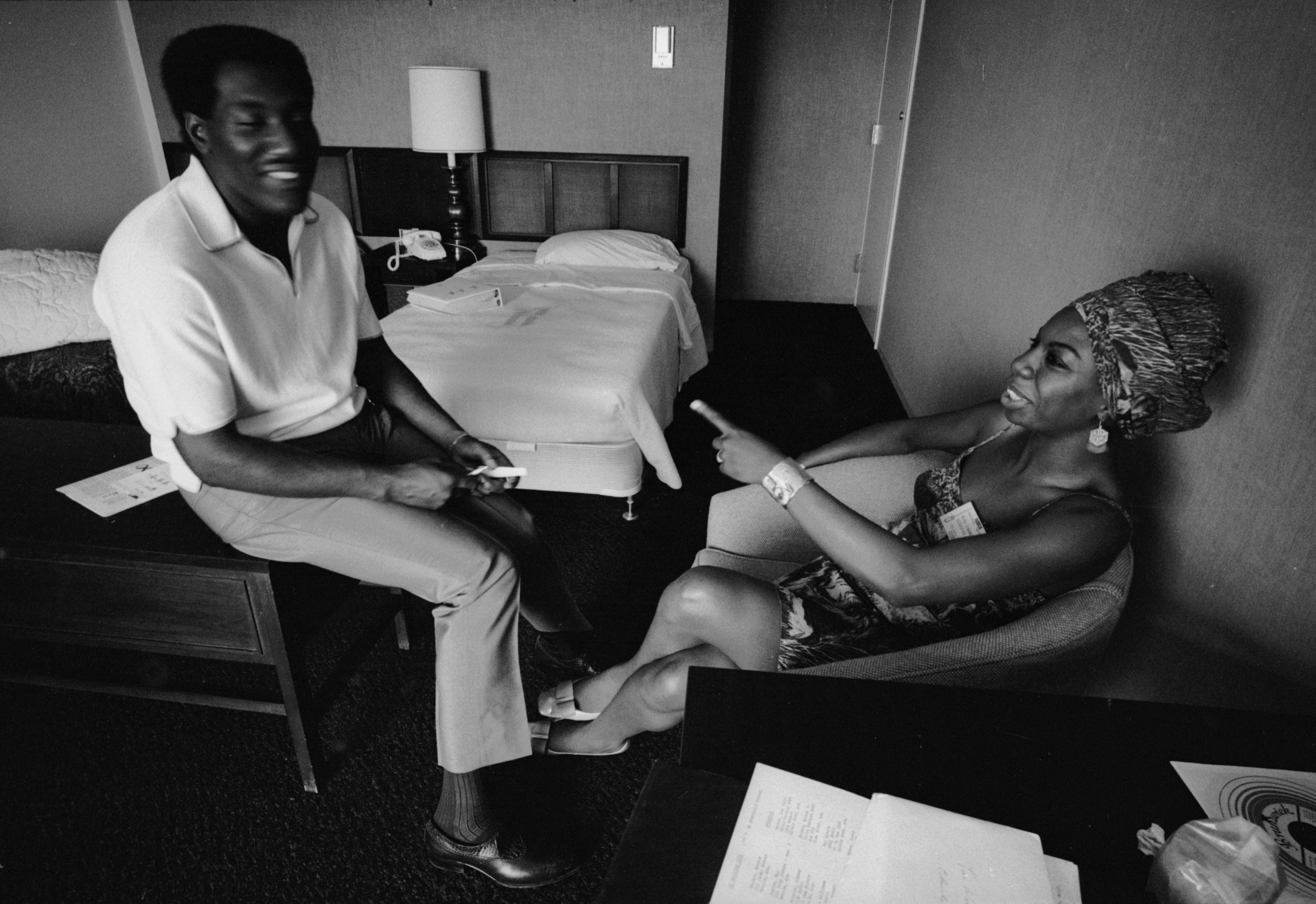 During the NARA (National Association of Radio Announcers) convention, musicians Otis Redding (1941 - 1967) and Nina Simone (born Eunice Waymon, 1933 - 2003) share a laugh in a room at the Regency Hyatt Hotel, Atlanta, Georgia, August 9 through 13, 1967. (Photo by Vernon Merritt III/Getty Images)