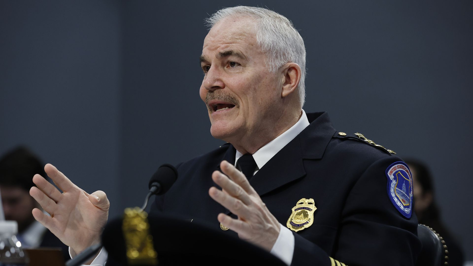 Capitol Police chief speaking while sitting.