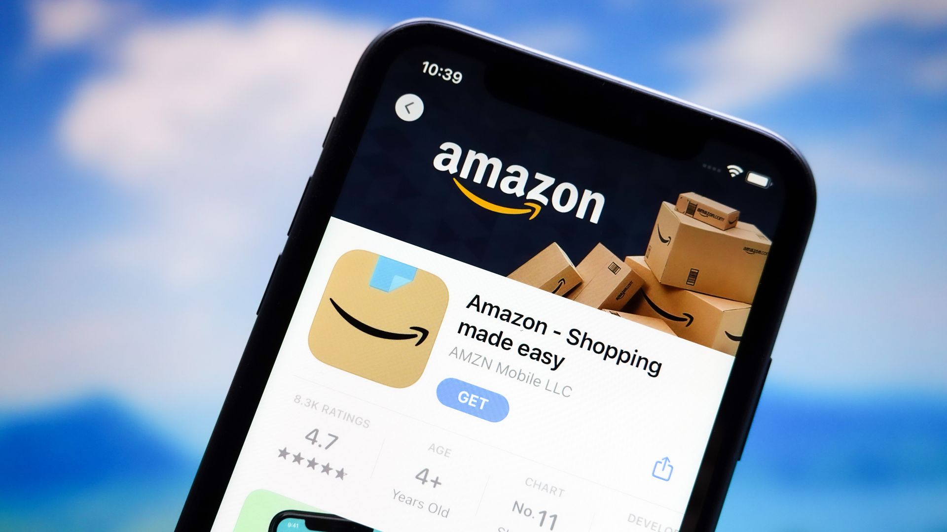 Amazon logo is displayed on the screen of  an Apple iPhone.