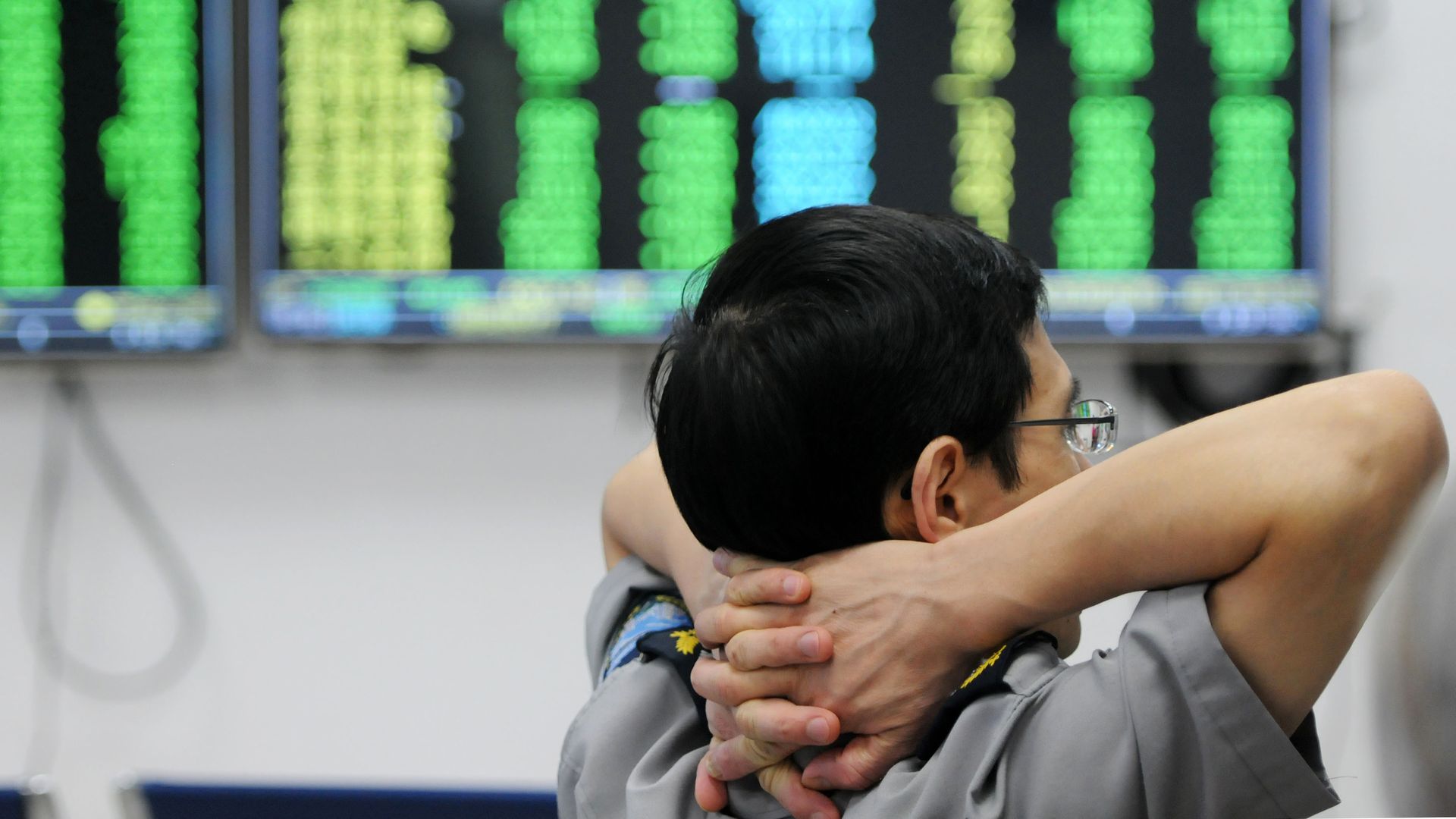 A security guard watching China stocks plummet