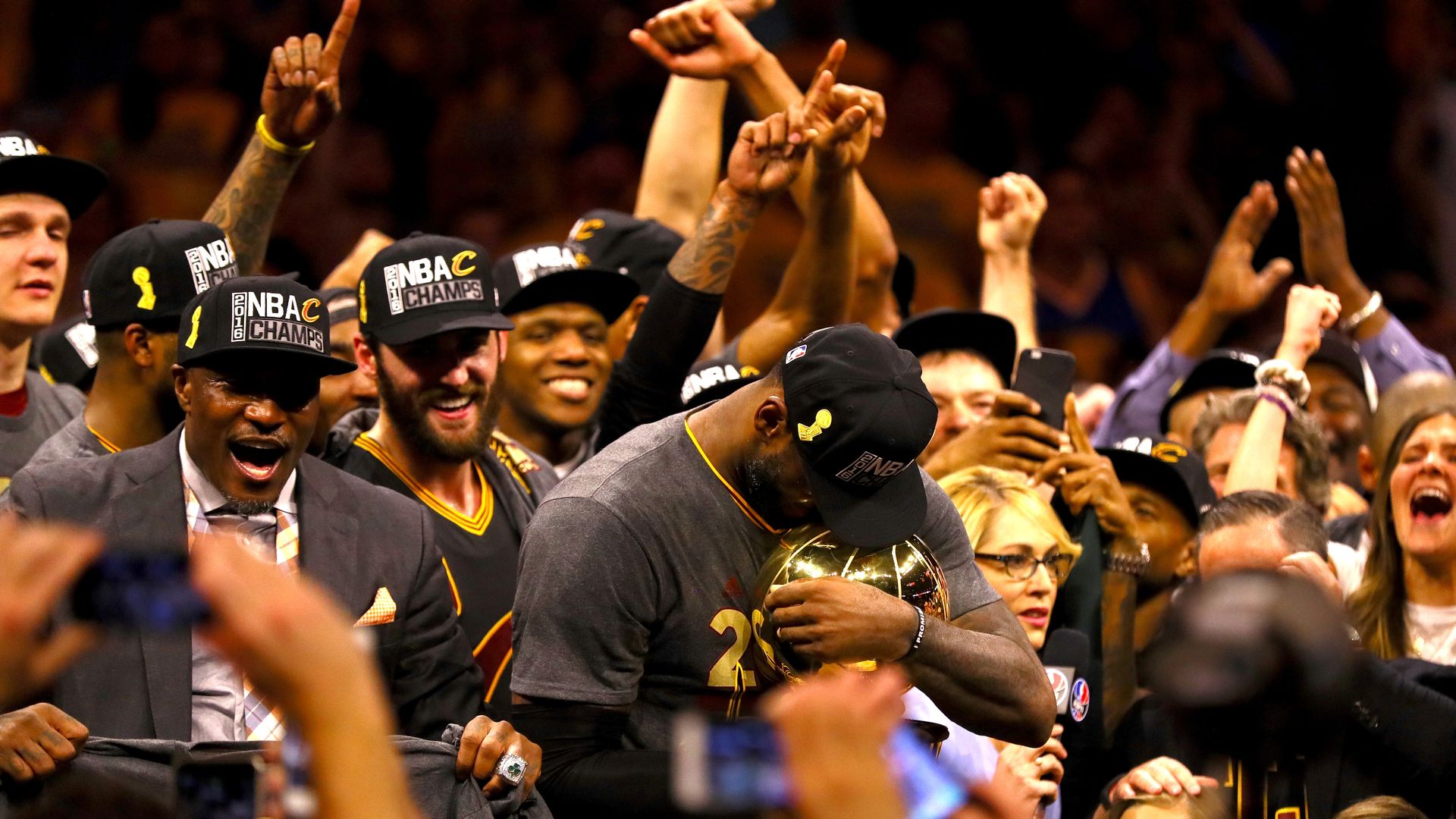 LeBron James holding the Larry O'Brien trophy