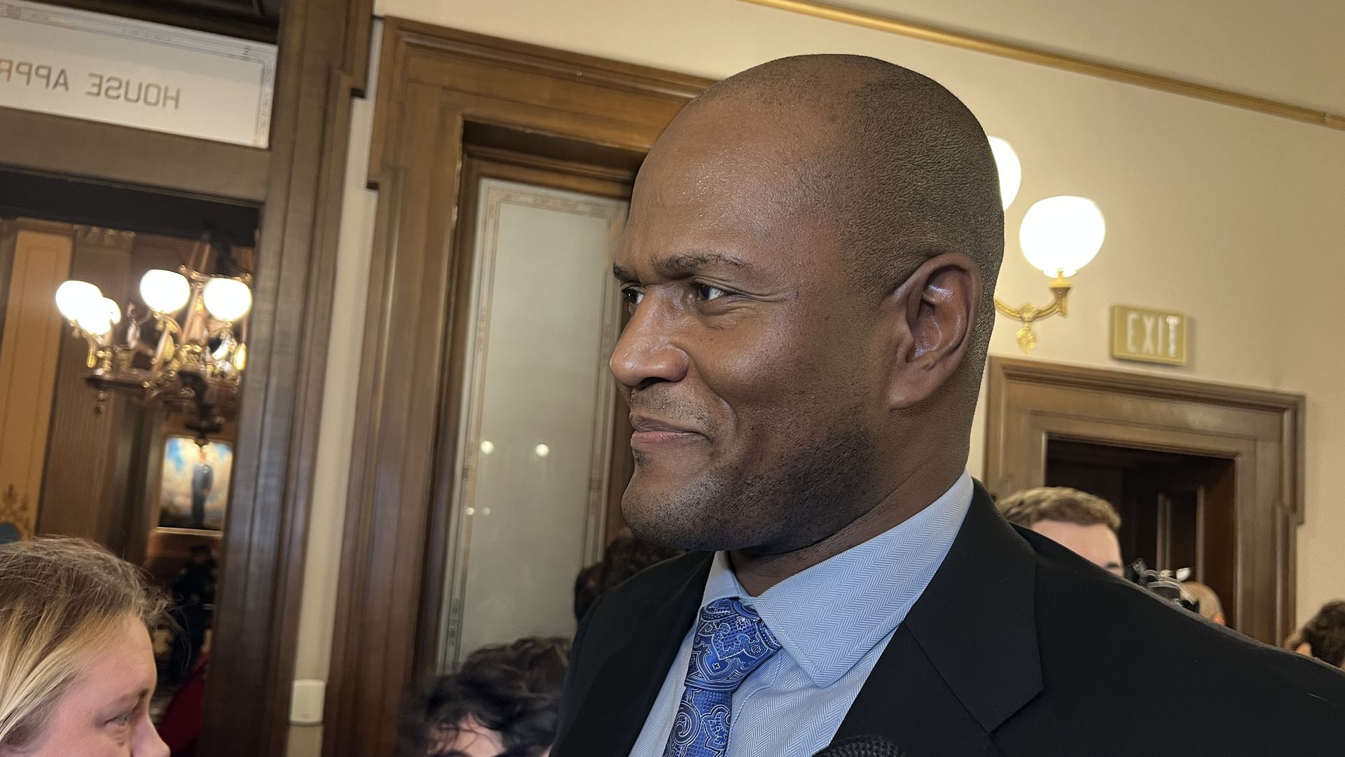 House Speaker Rep. Joe Tate (D-Detroit) answers questions from reporters inside the Capitol following Whitmer's address