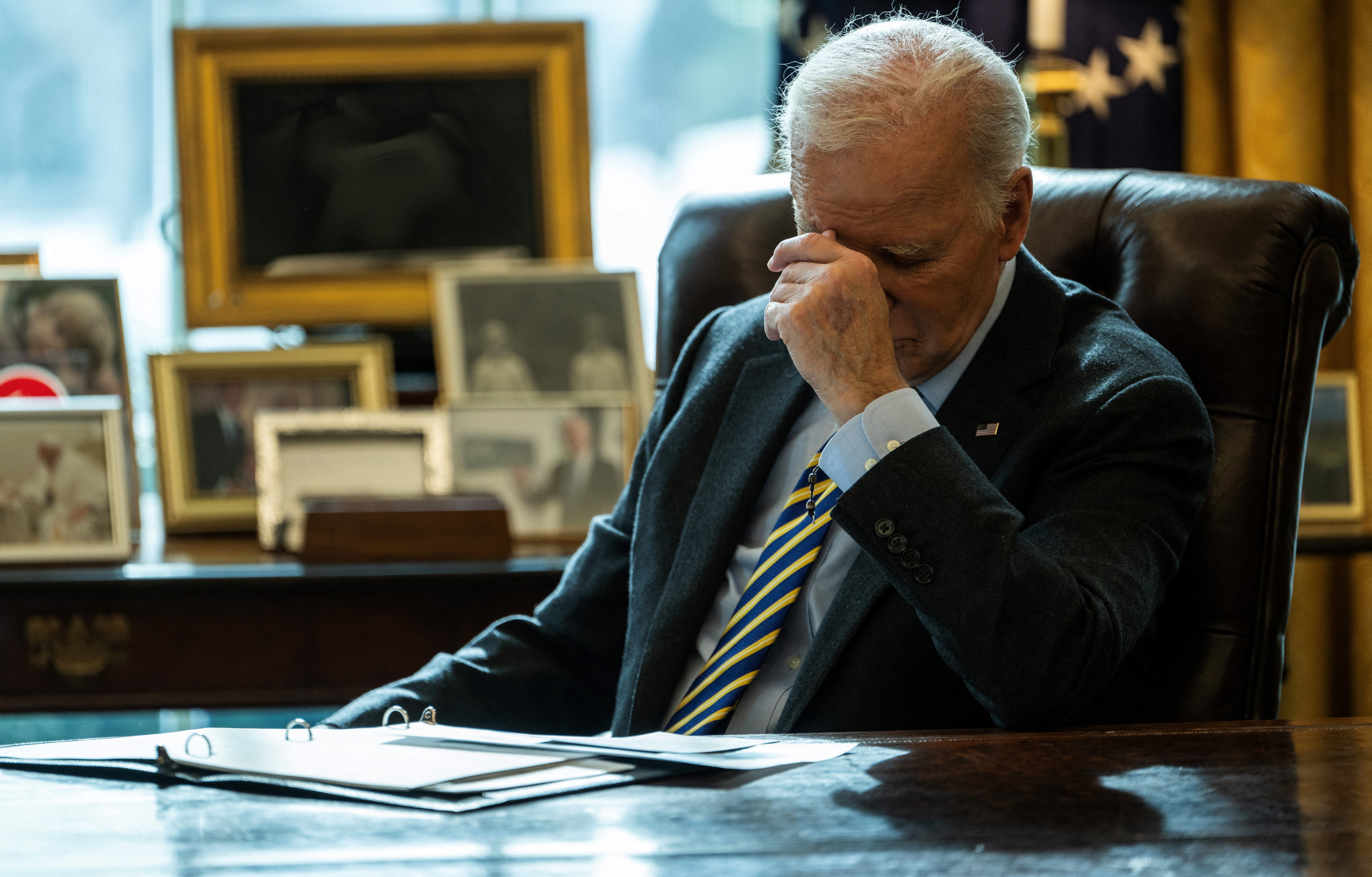President Biden listens during an Oval Office briefing in January.