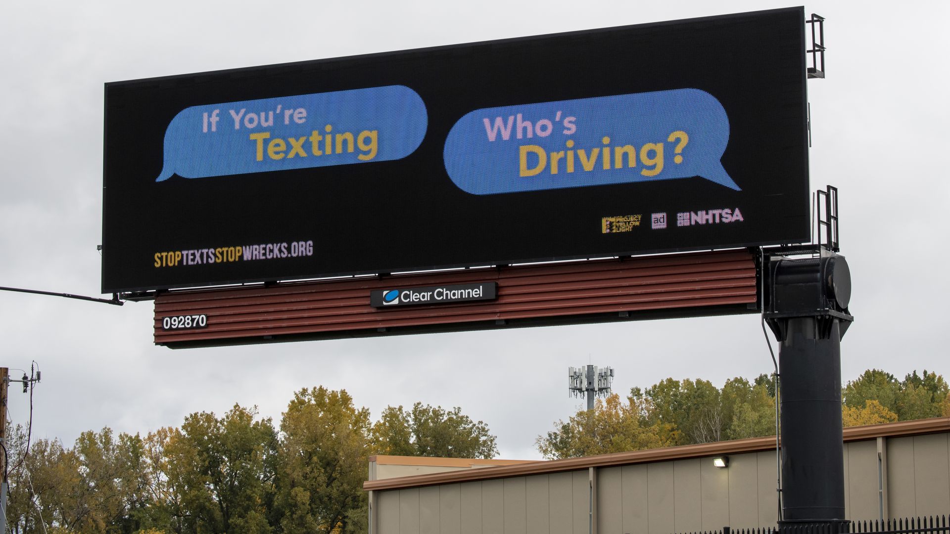 An anti-texting-while-driving billboard reading "If you're texting, who's driving?"