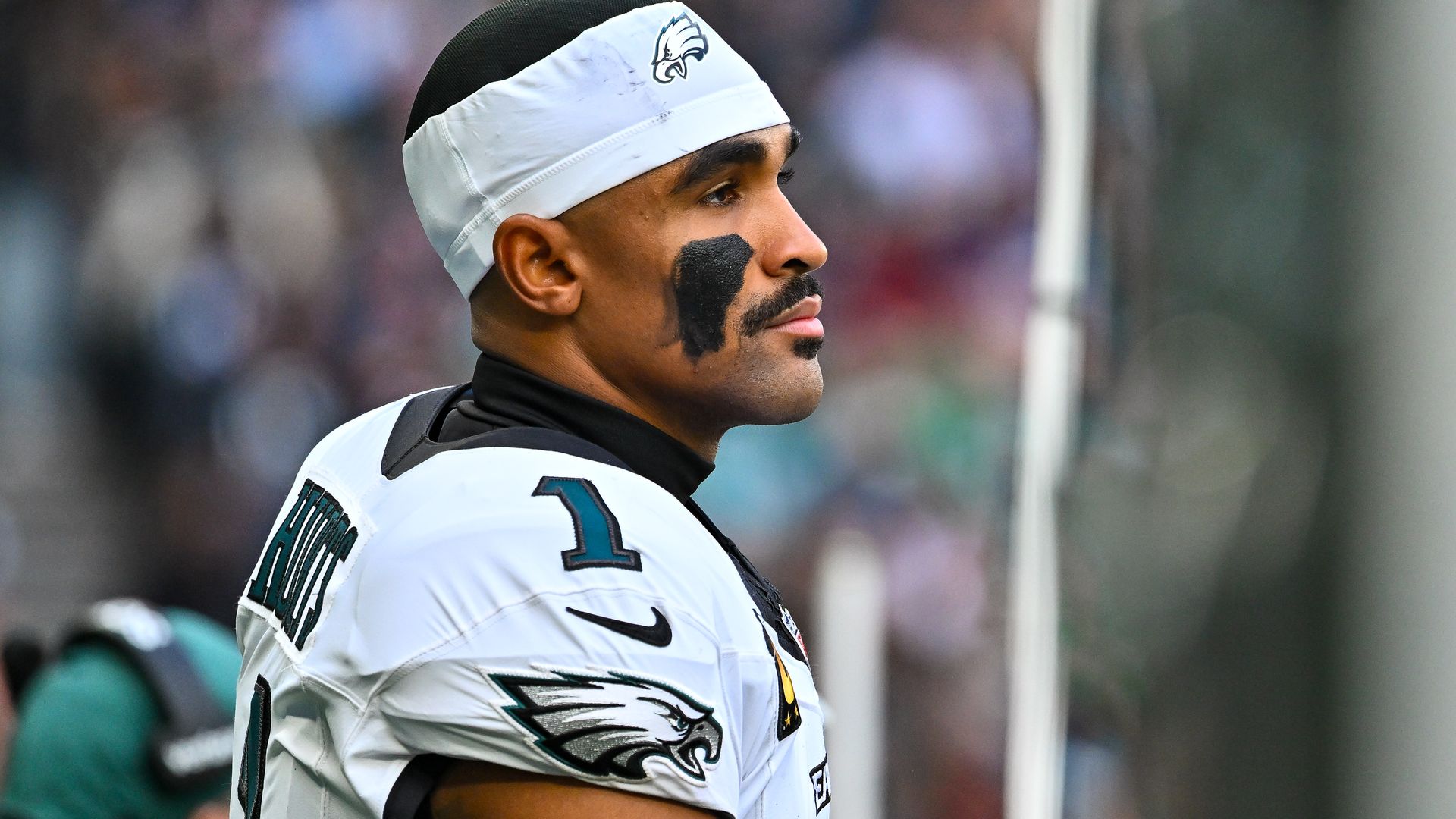 Eagles quarterback Jalen Hurts looking on against Jaguars.