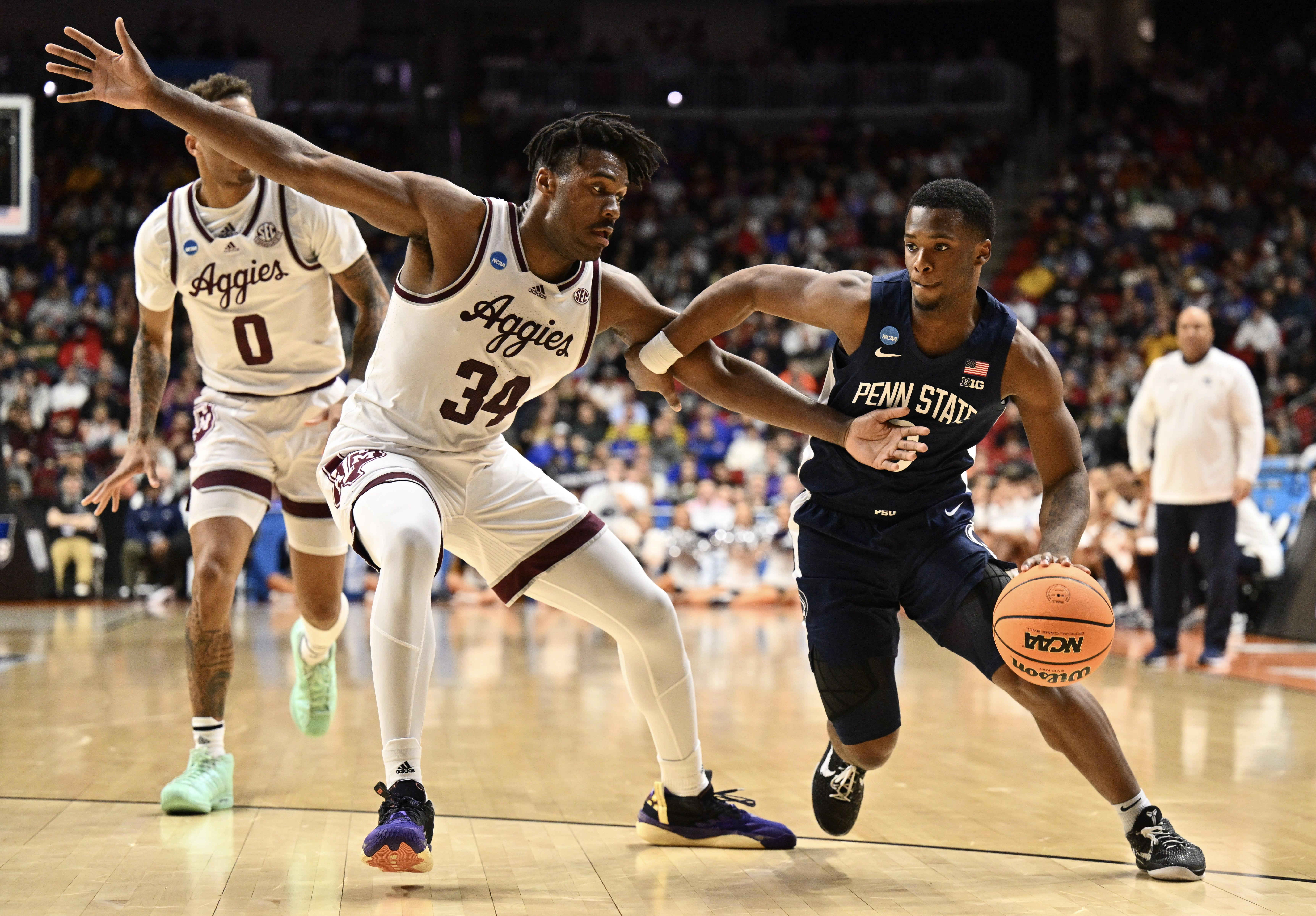 Photo of a basketball player dribbling a basketball