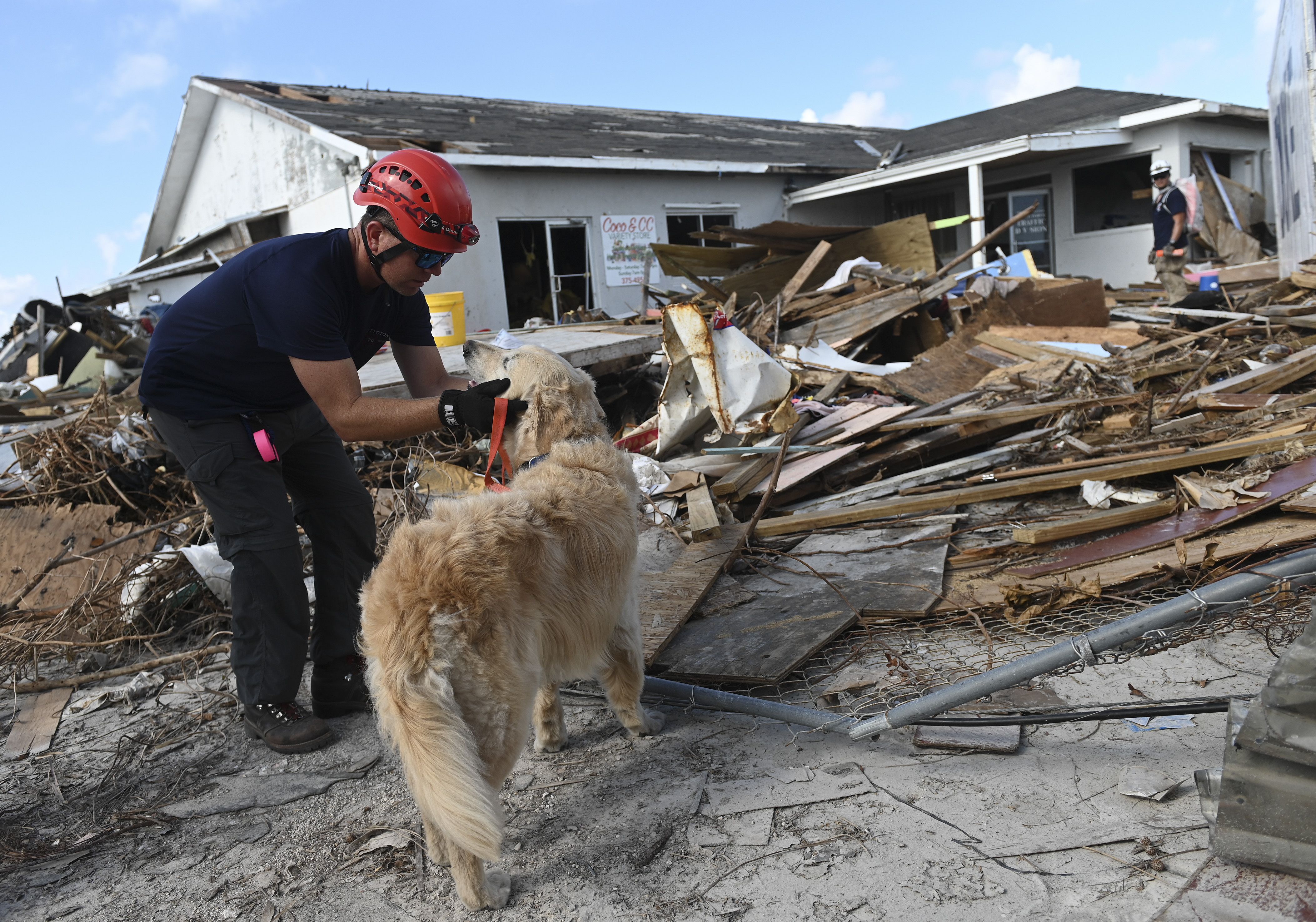  A Canadian search and rescue team search the debris in Marsh Harbour, Bahamas, on September 10