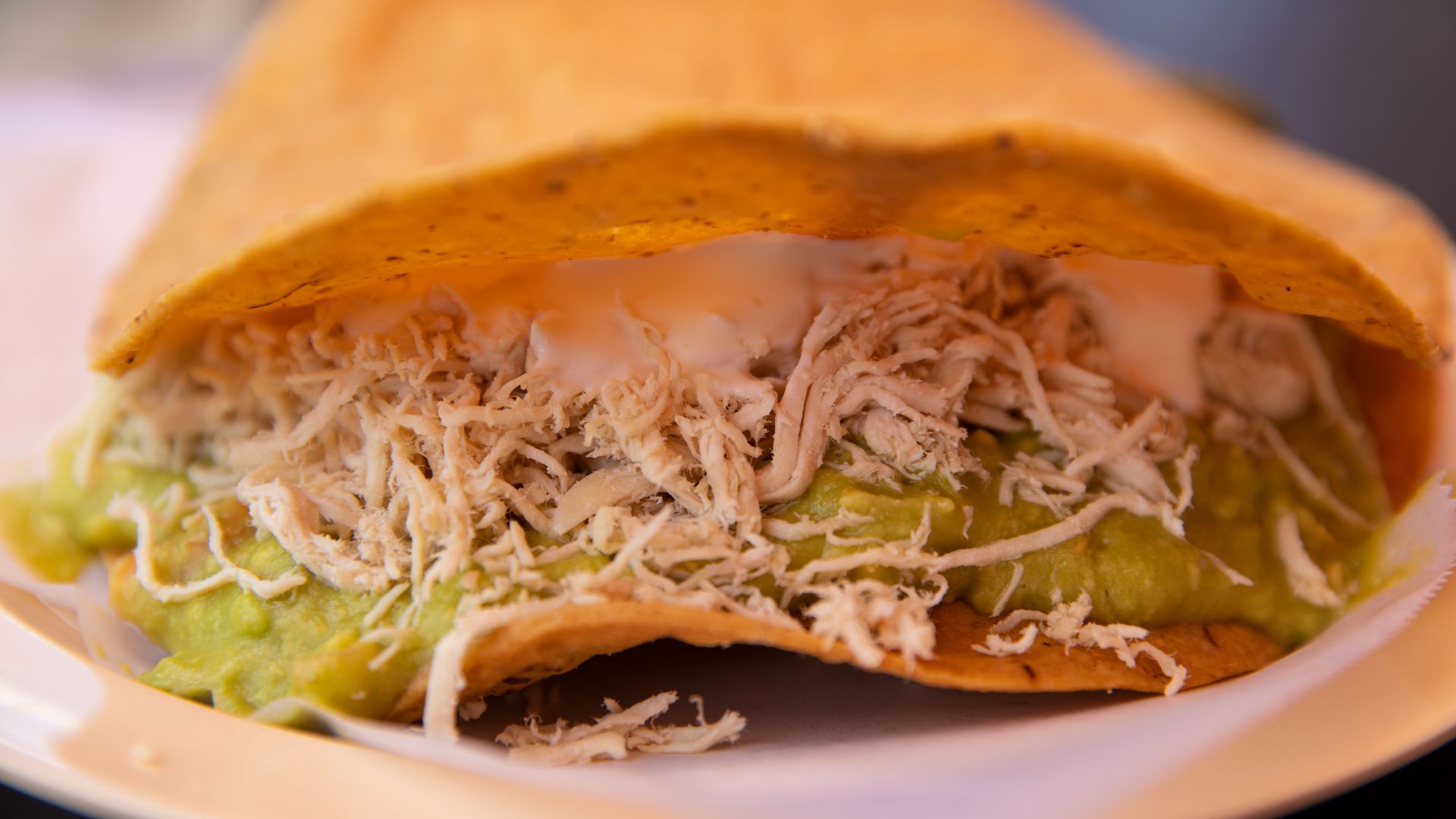 Tostada siberia, wth a mound of shredded chicken in the middle,  from the upcoming La Malinche. 