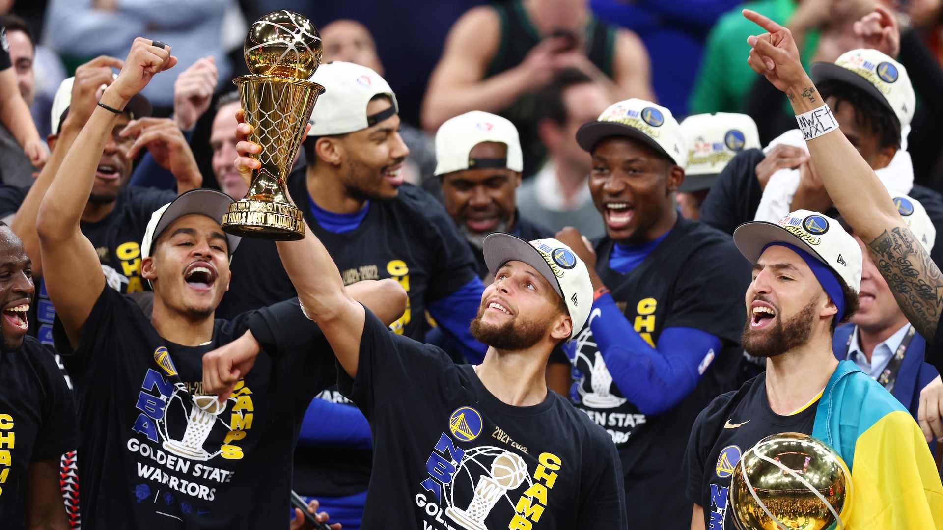 Stephen Curry of the Golden State Warriors raises the Most Valuable Player Award after beating the Boston Celtics in to win the NBA title on June 16 in Boston, Massachusetts. 