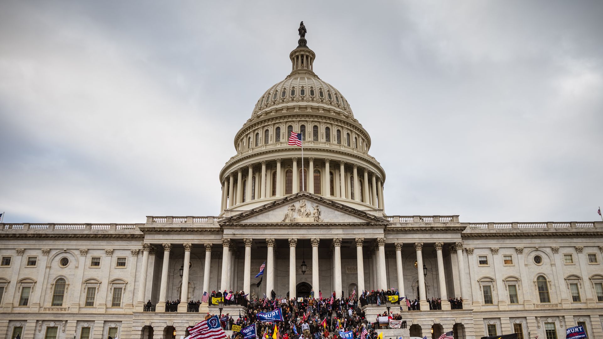 A large group of pro-Trump protesters stand on the East steps of the Capitol Building after storming its grounds on January 6, 2021 in Washington, DC. 