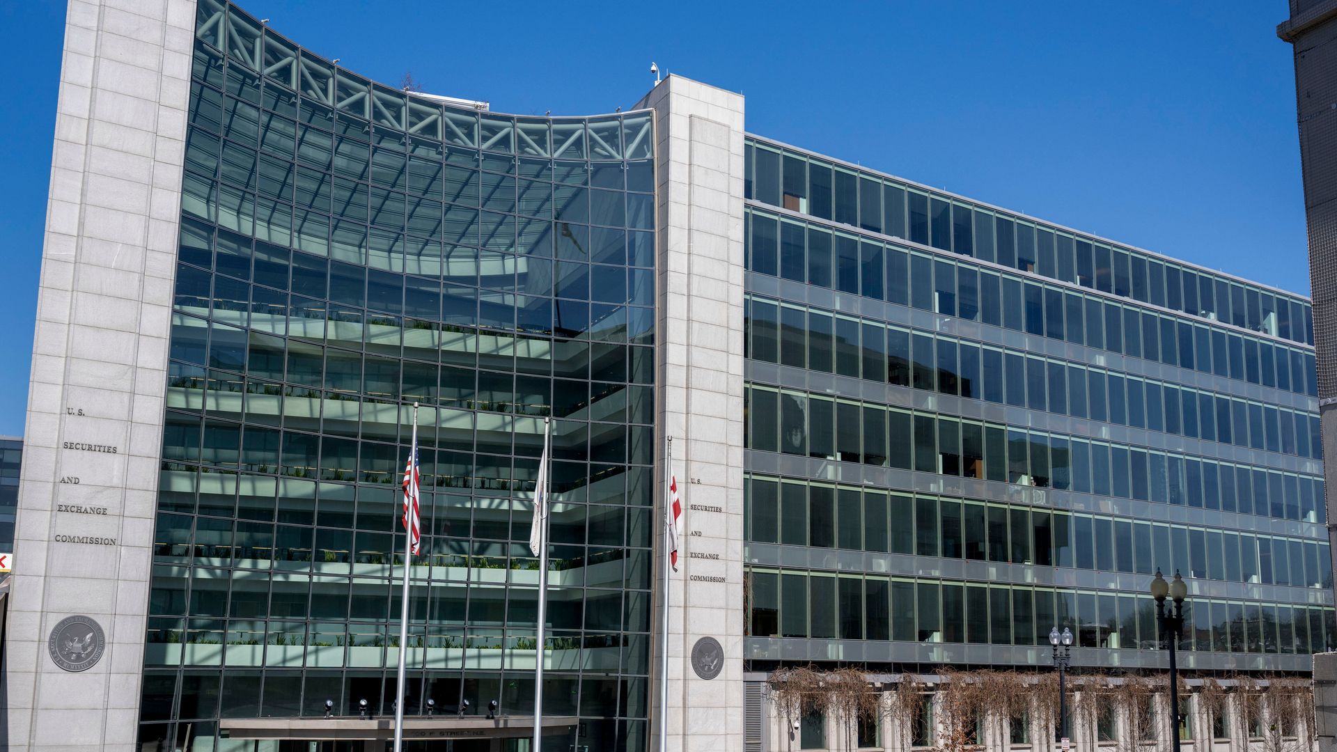 An official looking building with lots of glass windows.