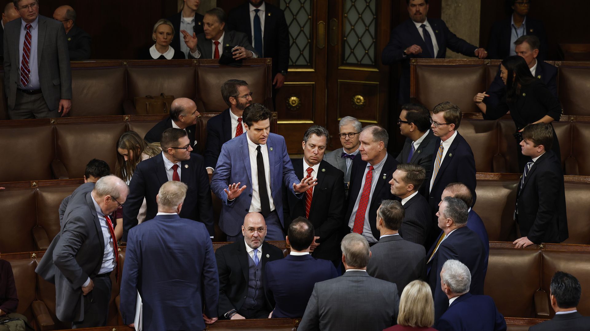 Rep.-elect Matt Gaetz talks to lawmakers inside the House chamber