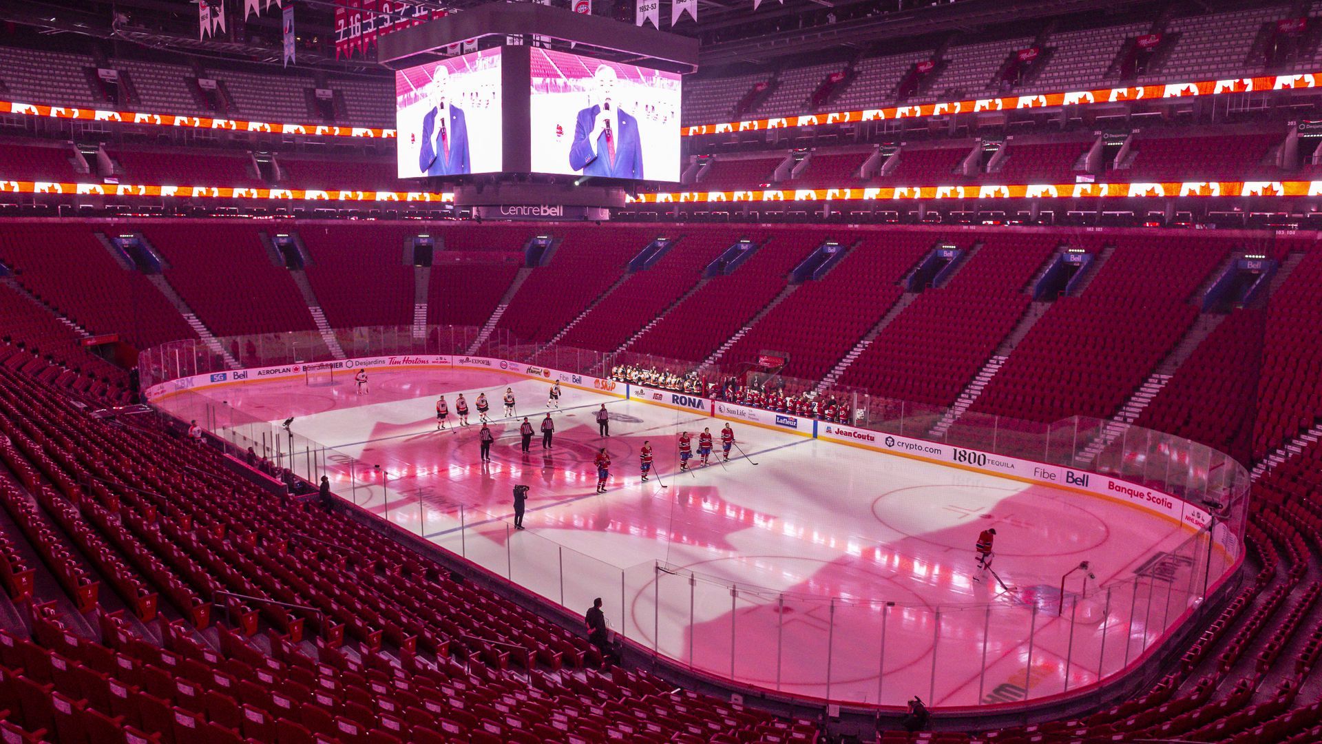 Picture of a basketball court and the lights are red