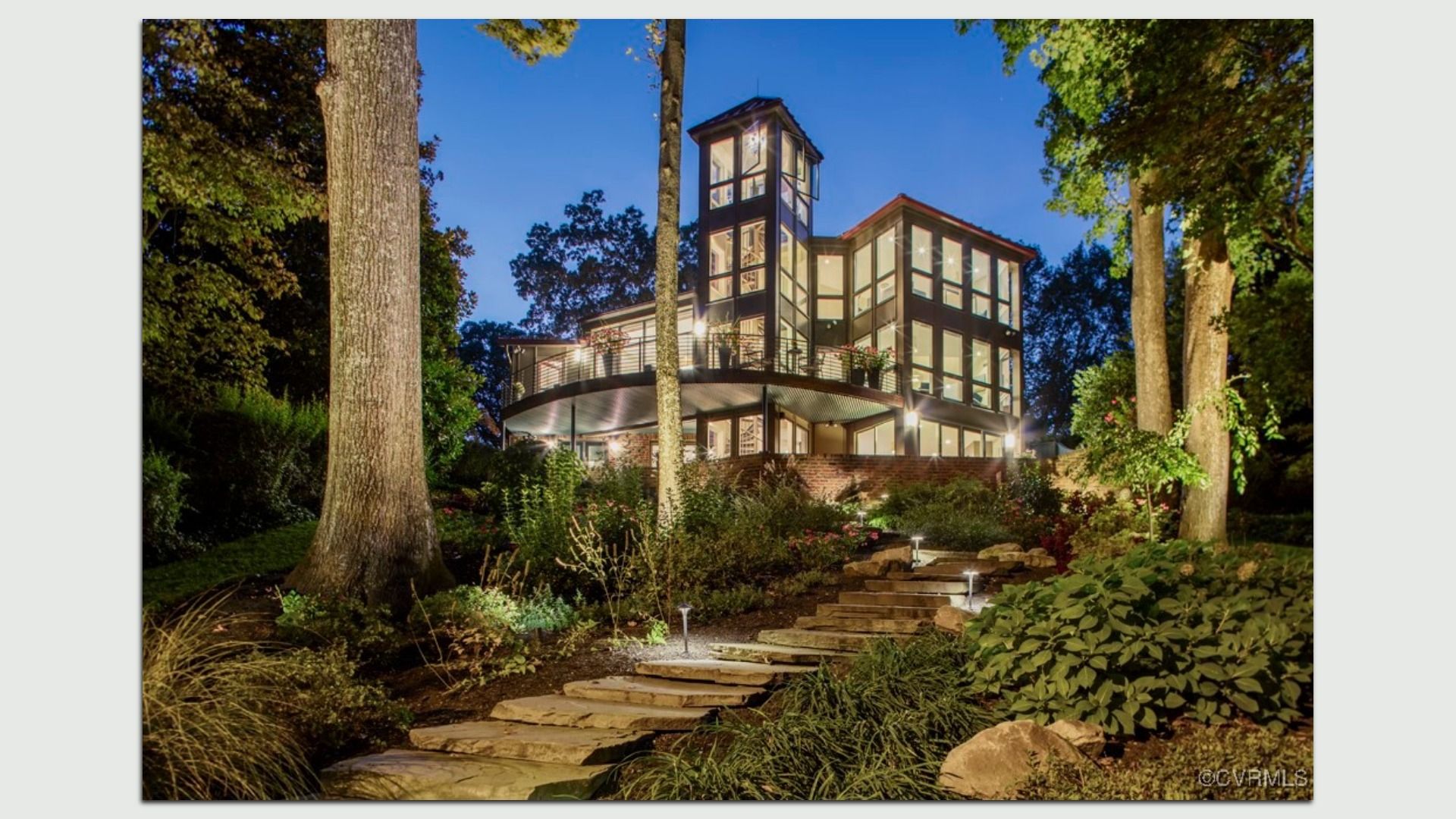 a four-story modern house with a big tower