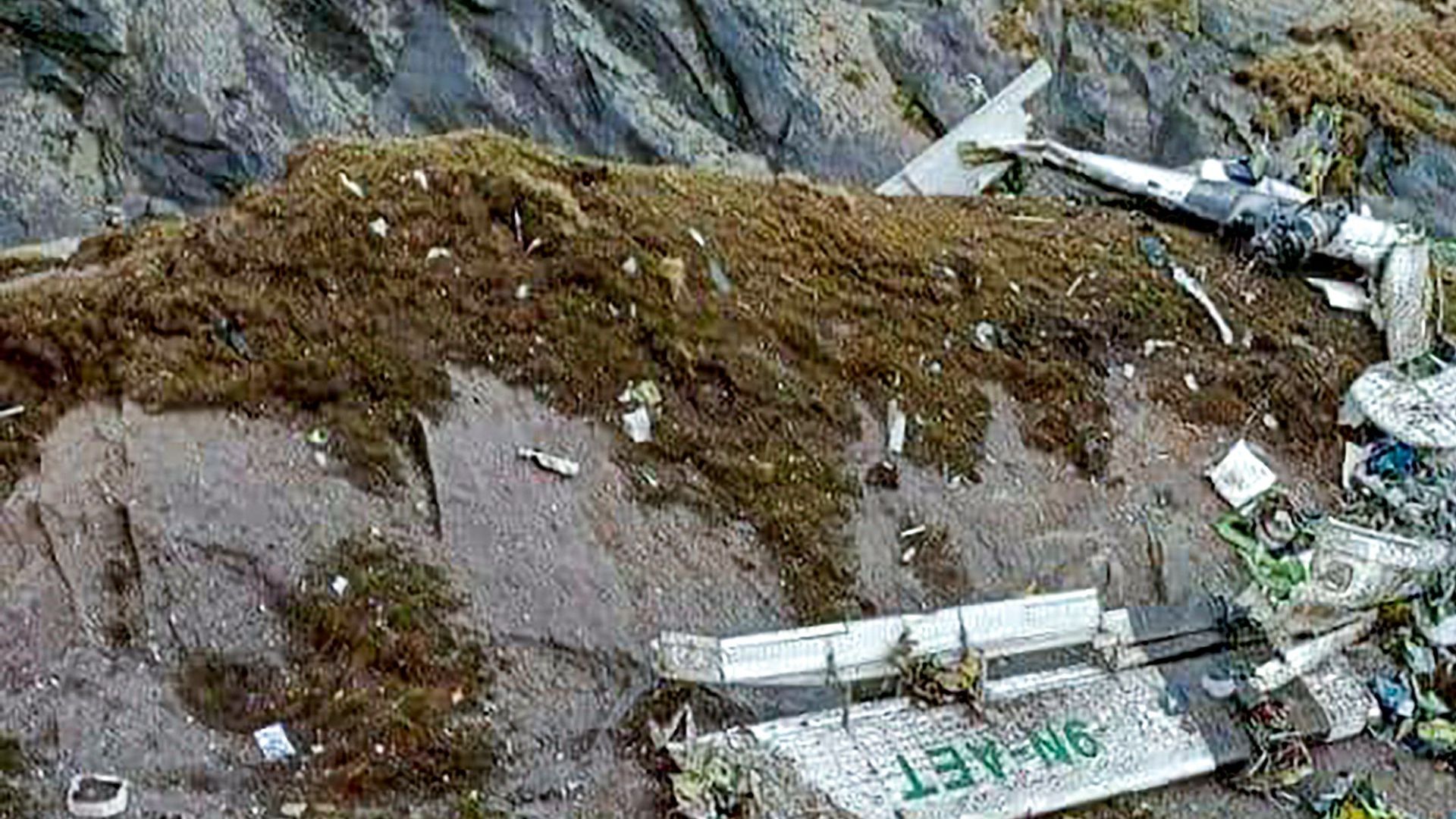  The wreckage of a Twin Otter aircraft, operated by Nepali carrier Tara Air, lay on a mountainside in Mustang on May 30, 2022, a day after it crashed. 