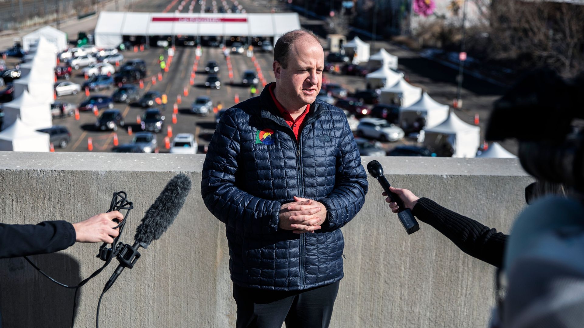 Colorado Gov. Jared Polis stands at a mass vaccination drive in January. Photo: Chet Strange/AFP via Getty Images