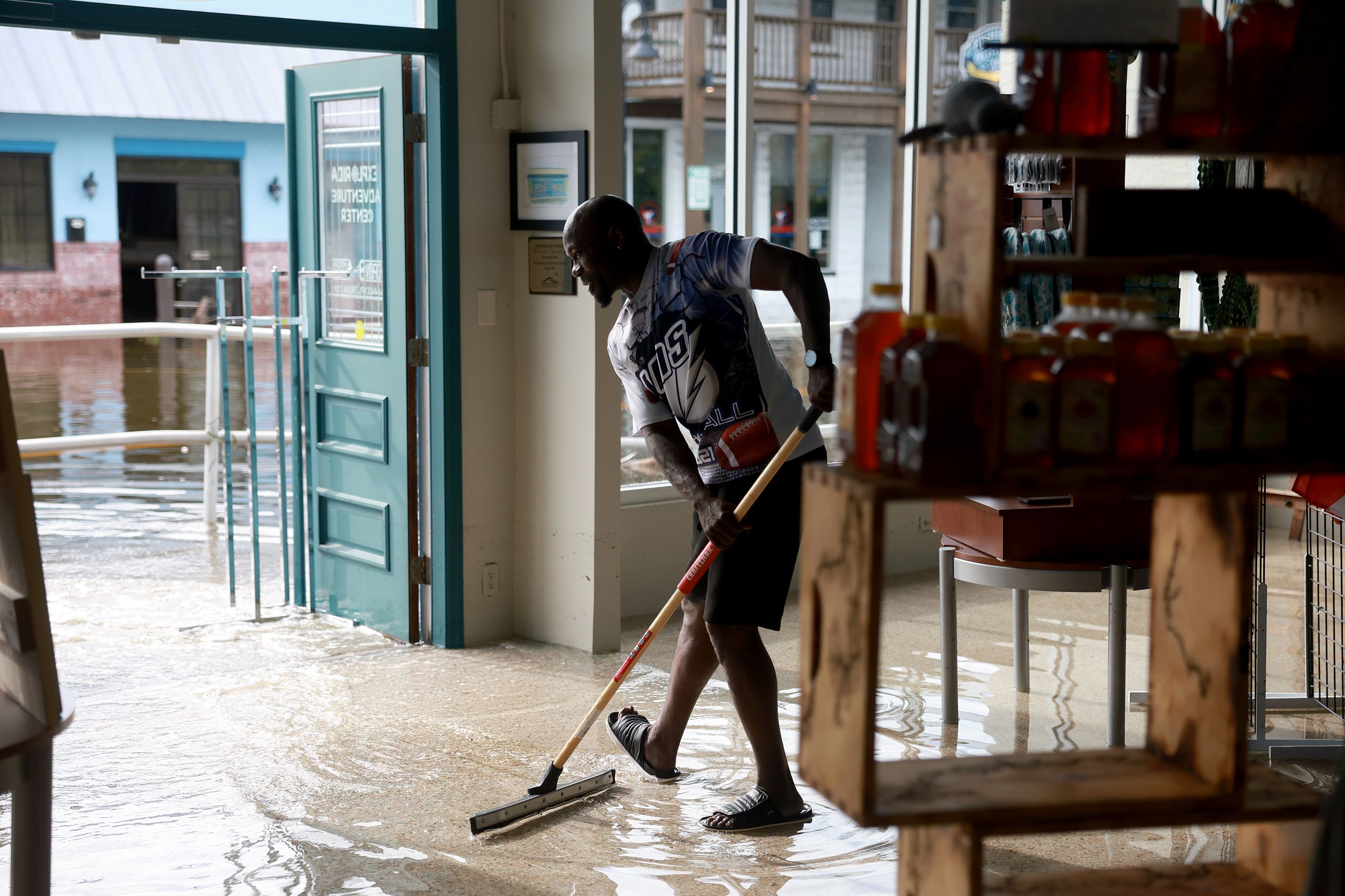  Donnye Franklin helps a friend try to get the flood waters out of his Explorer Manatee Tour store after Hurricane Idalia passed offshore on August 30, 2023 in Crystal River, Florida. Hurricane Idalia hit the Big Bend area on the Gulf Coast of Florida as a Category 3 storm. 
