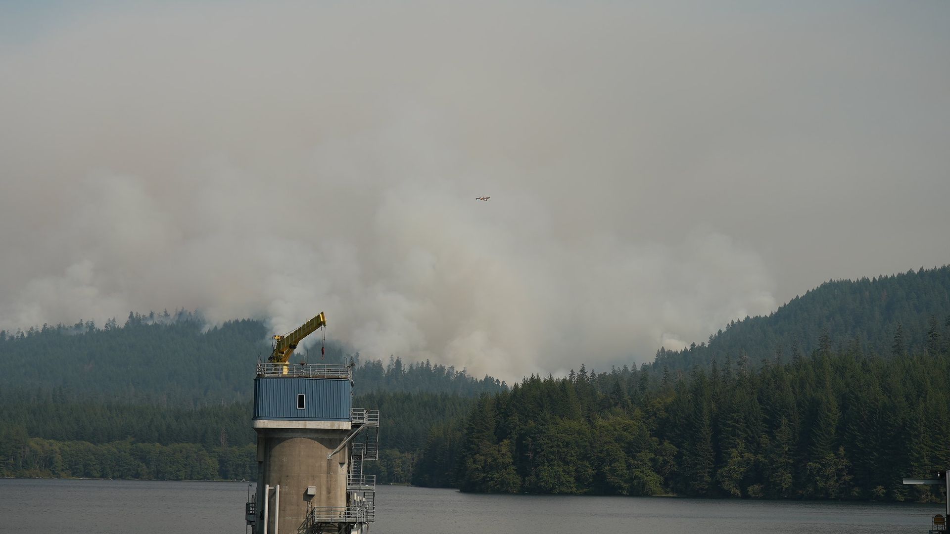 A photo of a mountain free line with smoke in the air.