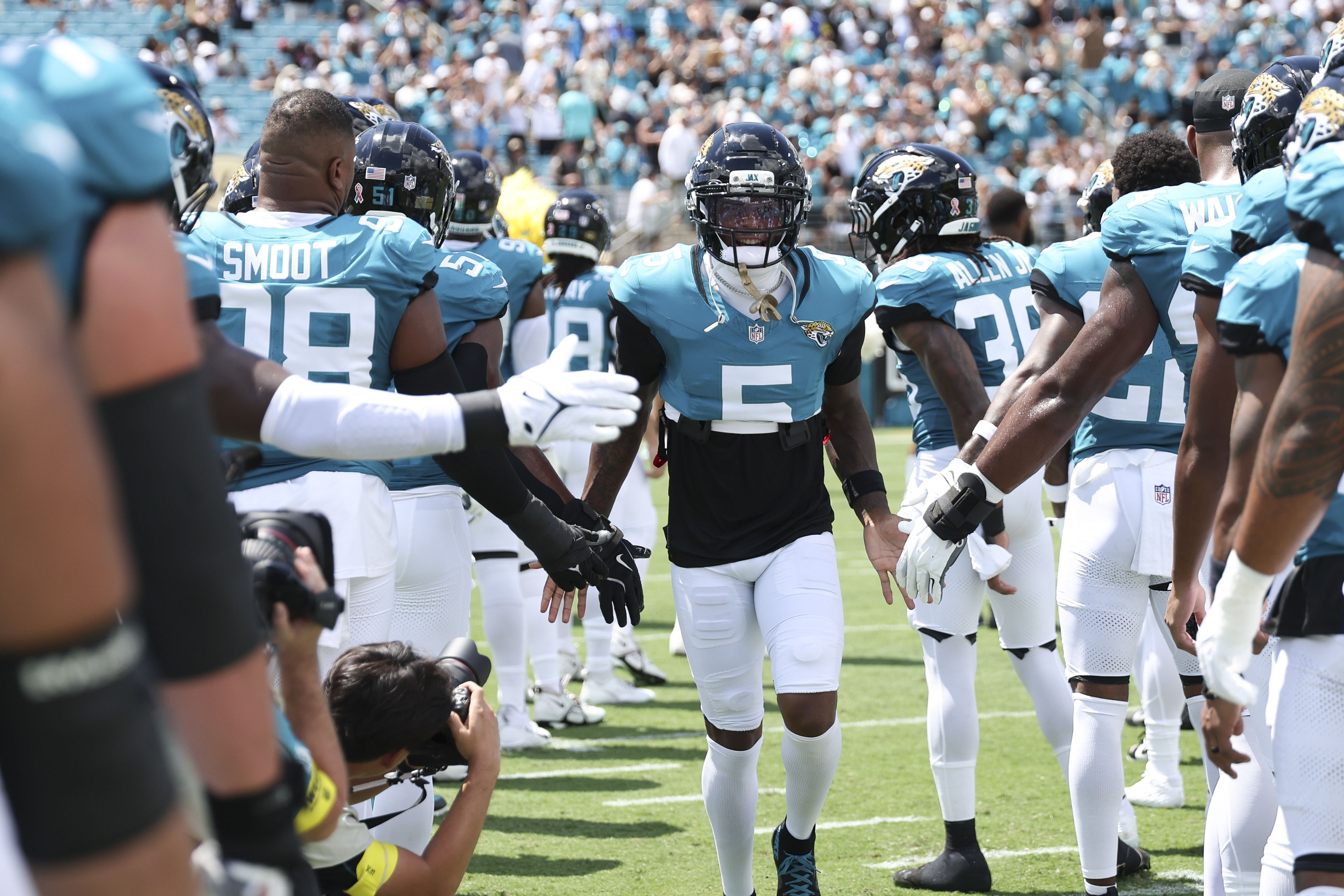 Dyami Brown #5 of the Jacksonville Jaguars runs on to the field for player intros prior to an NFL football game against the Carolina Panthers at Everbank Stadium on September 07, 2025 in Jacksonville, Florida.