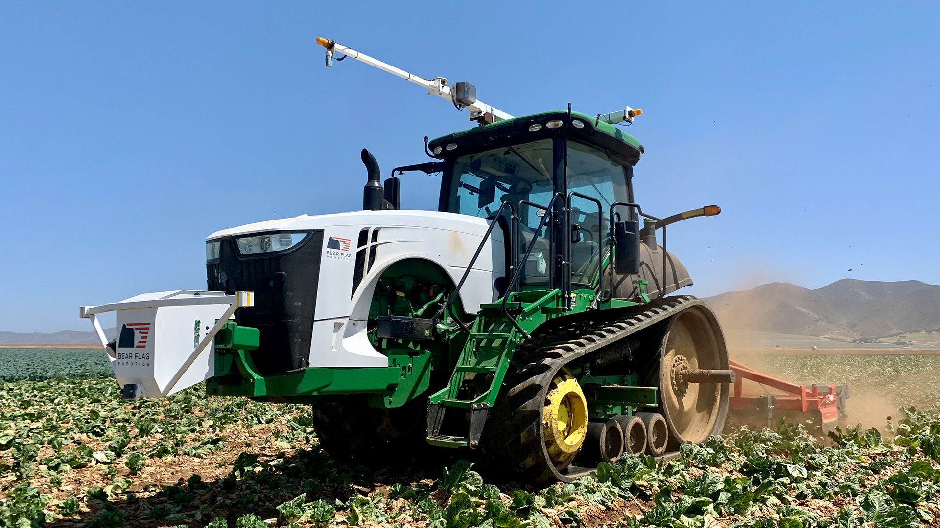 Image of a driverless John Deere tractor in operation