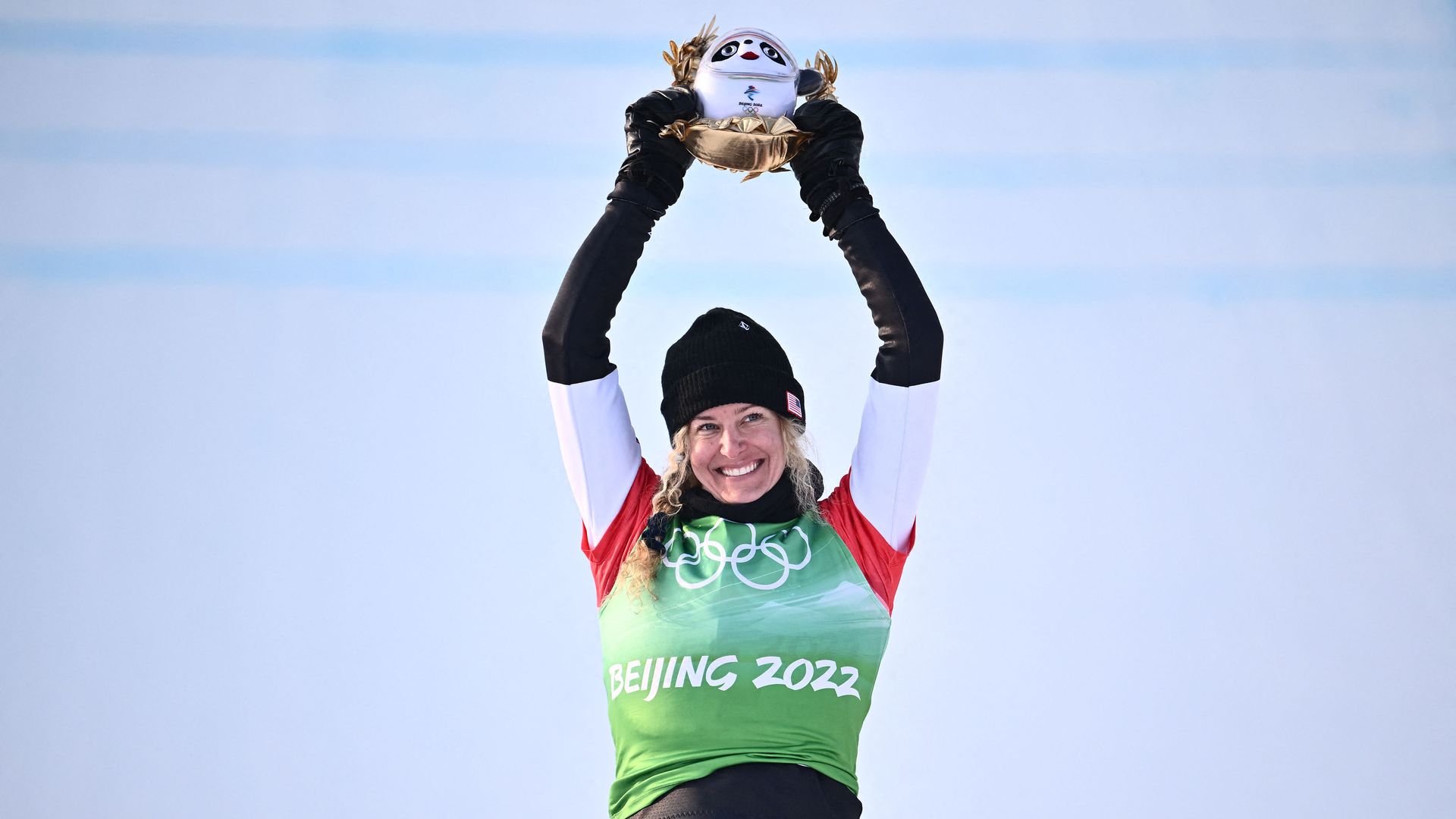  Gold medallist USA's Lindsey Jacobellis celebrates on the podium during the venue ceremony after the snowboard women's cross final during the Beijing 2022 Winter Olympic Games Feb. 9