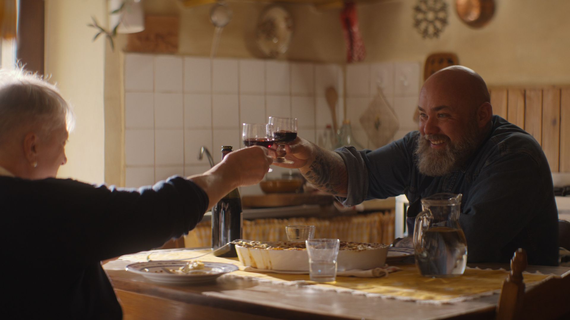 Evan Funke clinking wine glasses