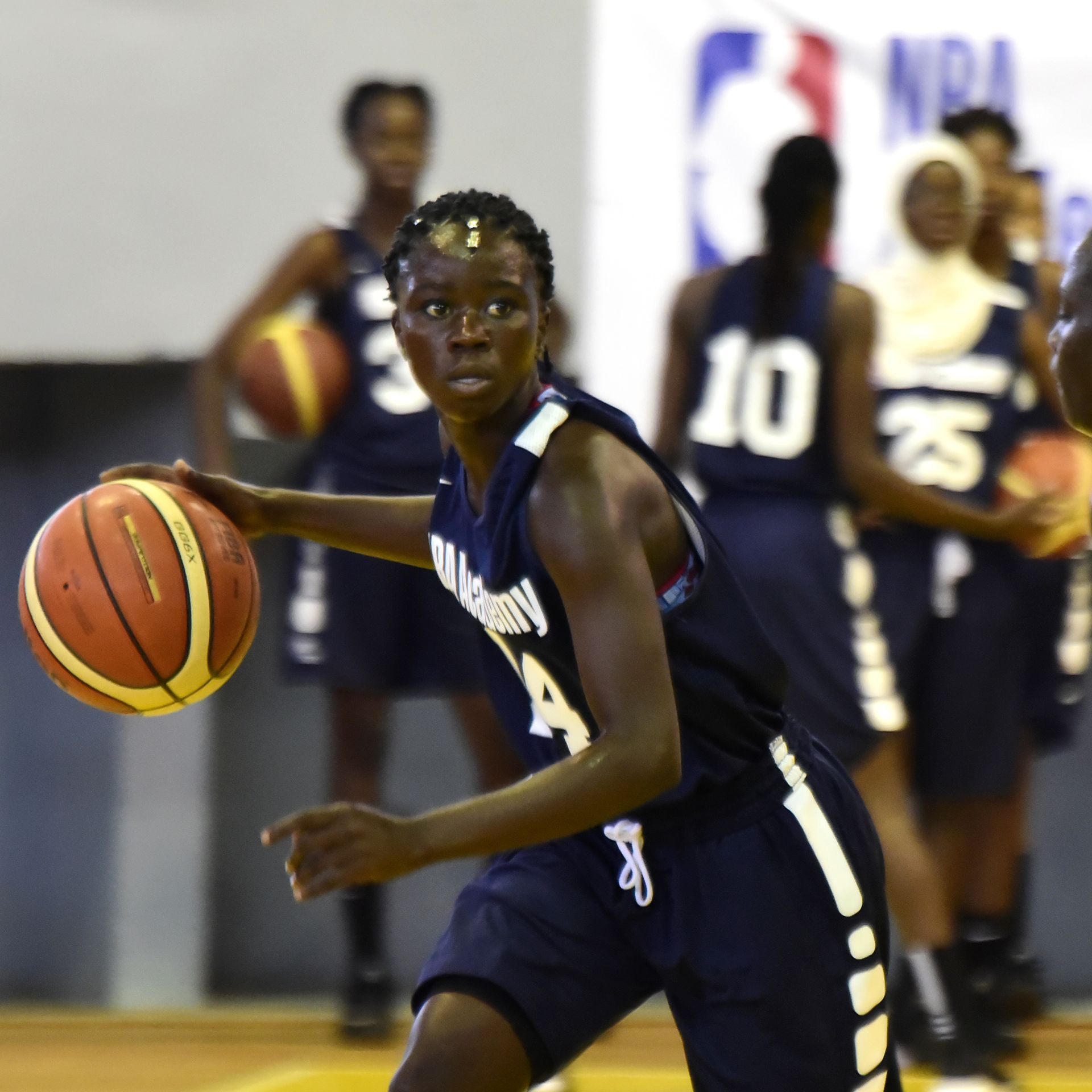 Satou Diop dribbles the ball as she takes part in an NBA Academy Africa basketball camp at Maurice Ndiaye Stadium in Dakar on May 11, 2018. 
