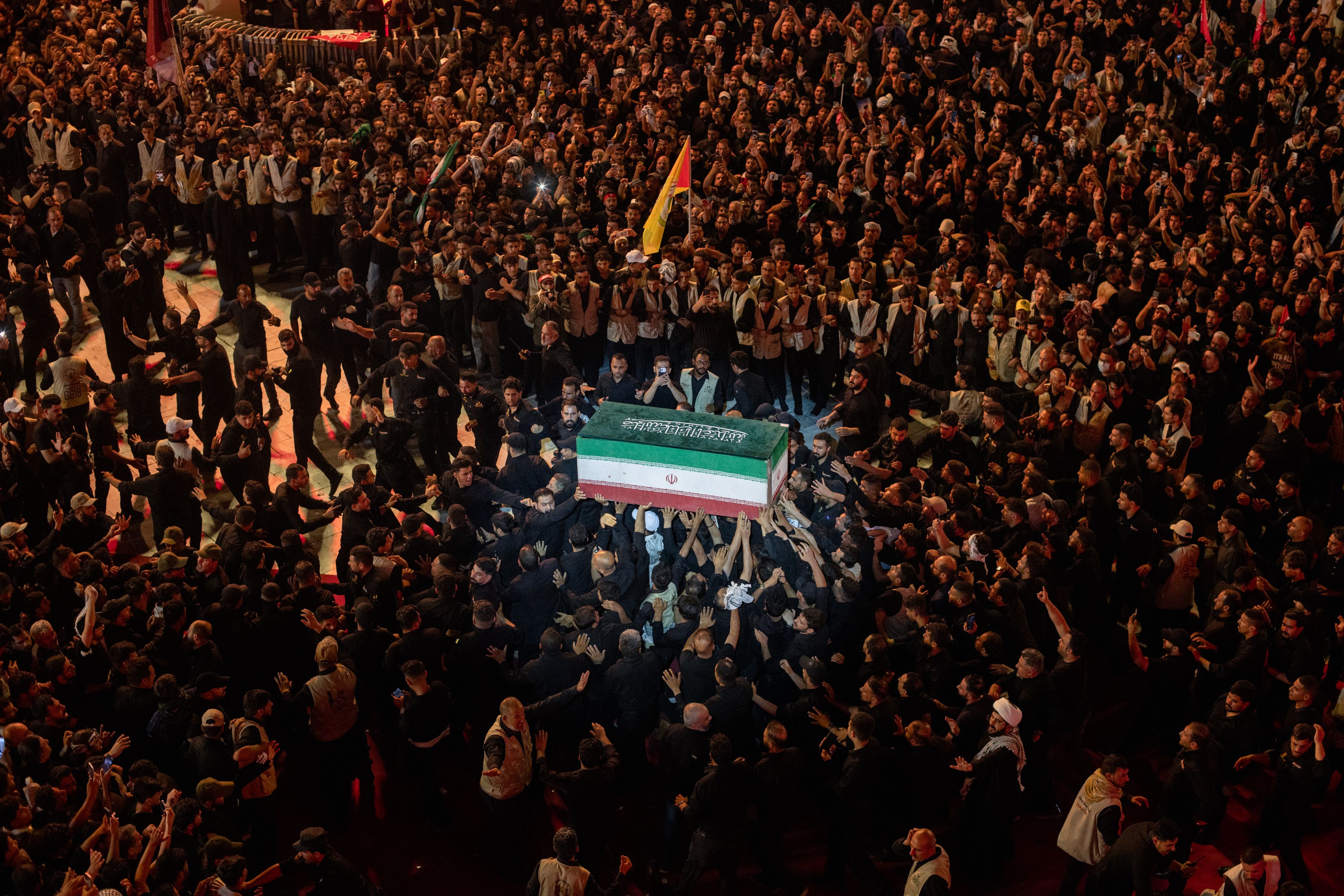 Mourners touch the coffin of Iran's Ayatollah Ali Khamenei during this week's funeral procession in Karbala, Iraq. Photo: Elke Scholiers/Getty Images