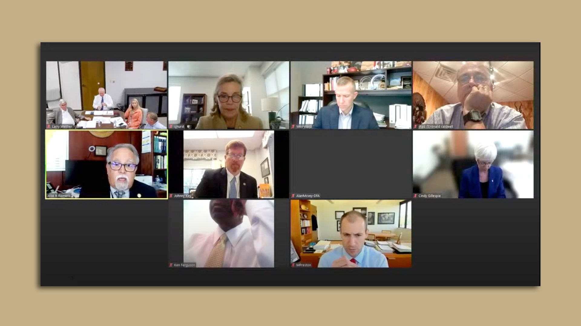 A screen shot of several people on a Zoom meeting. 