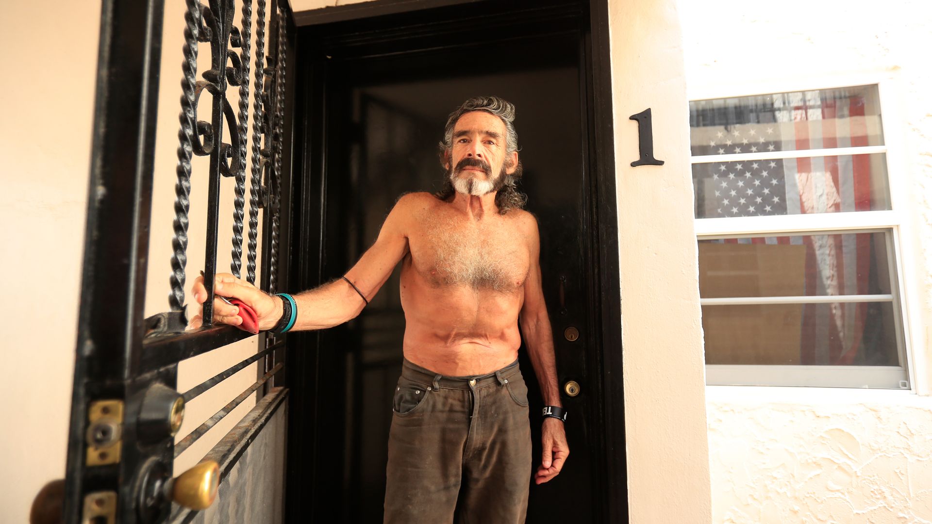 MIAMI BEACH, FLORIDA - MARCH 29: Robert "Raven" Kraft comes out of his apartment on March 29, 2020 in Miami Beach, Florida. Kraft, who has run every day on Miami Beach since January 1, 1975, continues to run eight miles daily despite the dangers that the COIVD-19 epidemic presents. (Photo by Cliff H