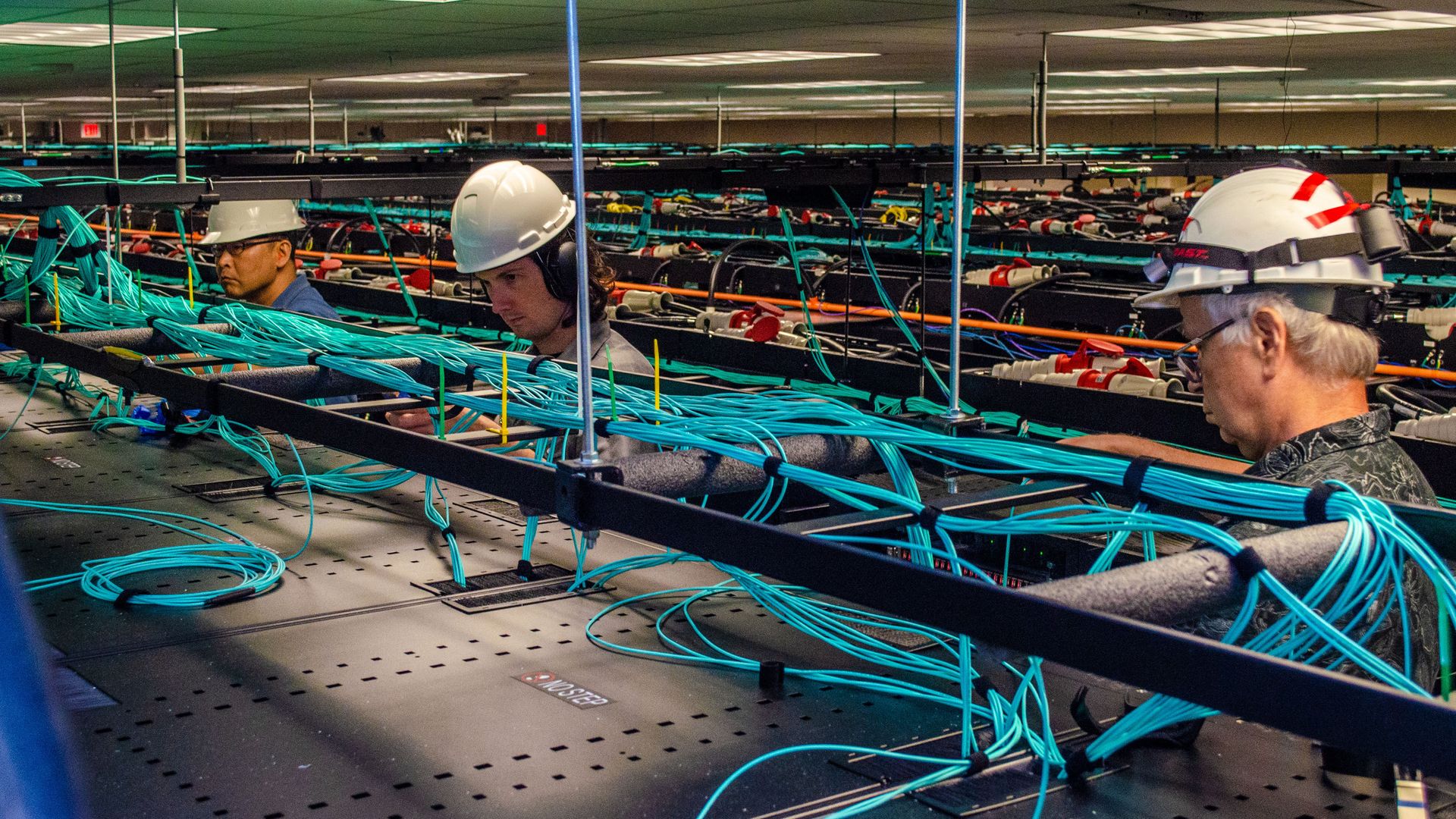 Workers tending to a super computer at the University of Texas.