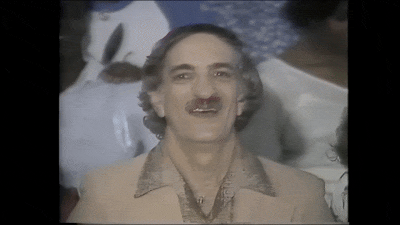 Image shows a TV commercial with Al Scramuzza.