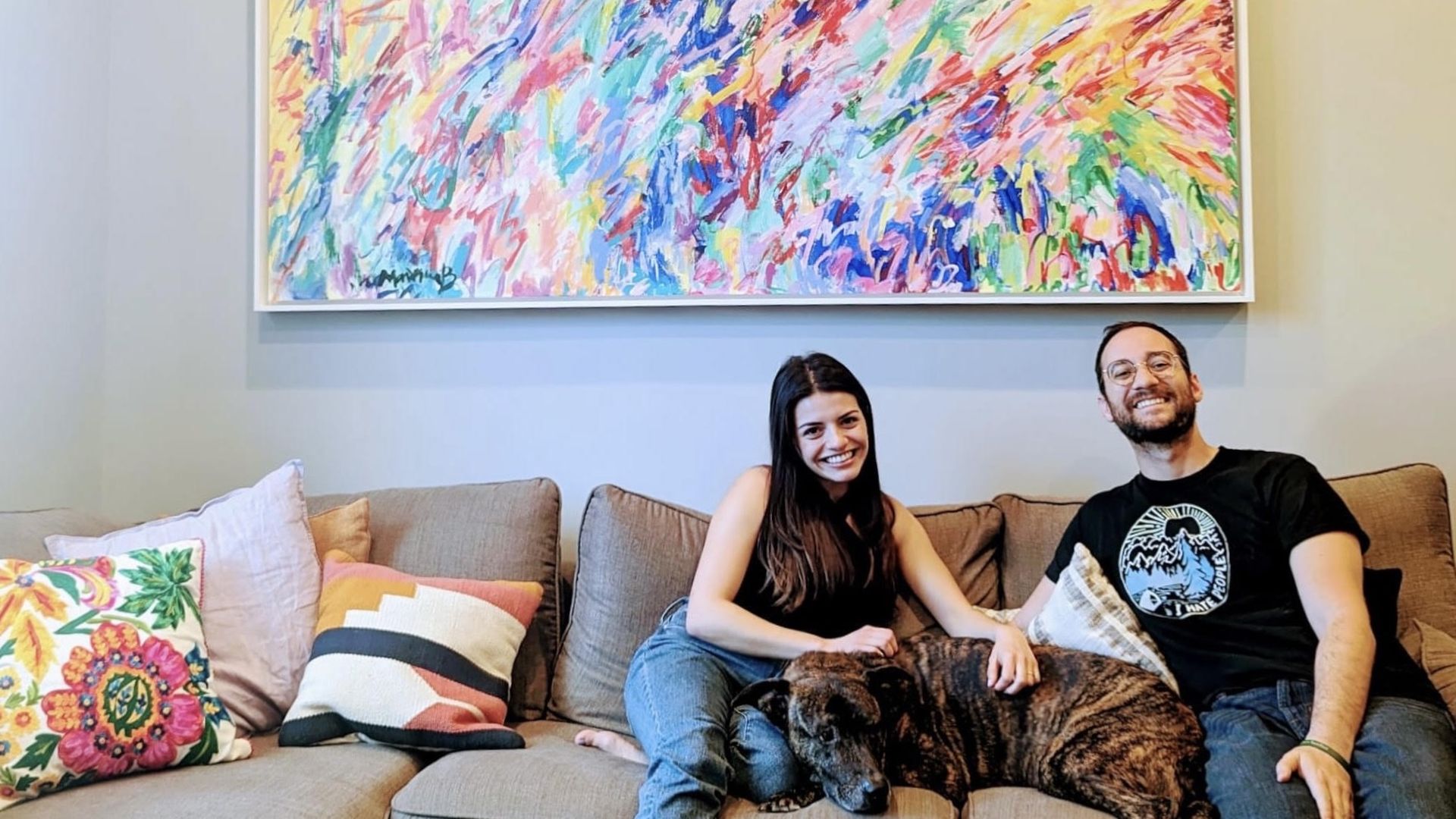 Homebuyers Sofia Cortes and Jason Johnson with their dog, 