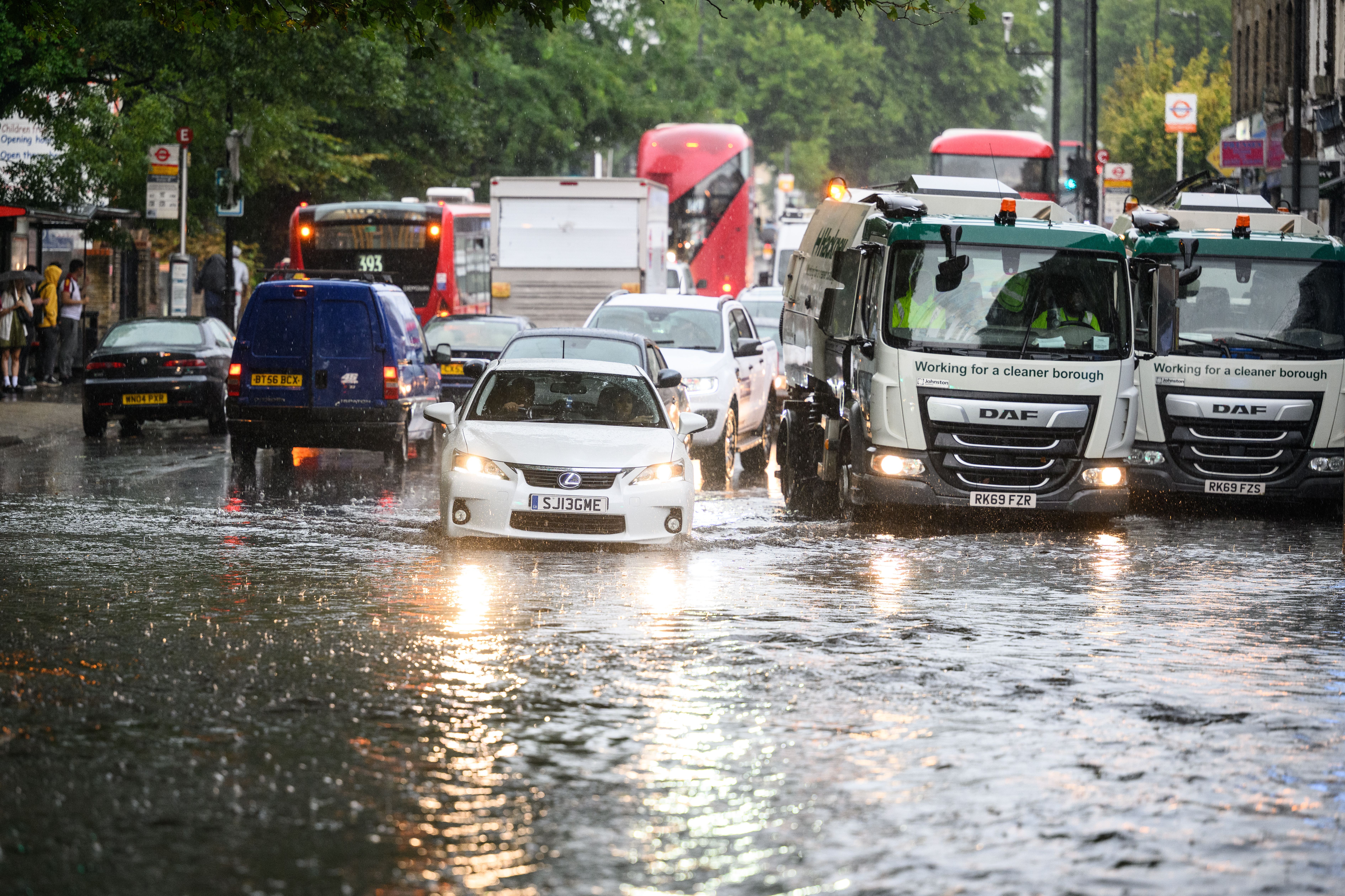  A car negotiates a flooded section of road, as torrential rain and thunderstorms hit the country on August 17, 2022 in London, England. 
