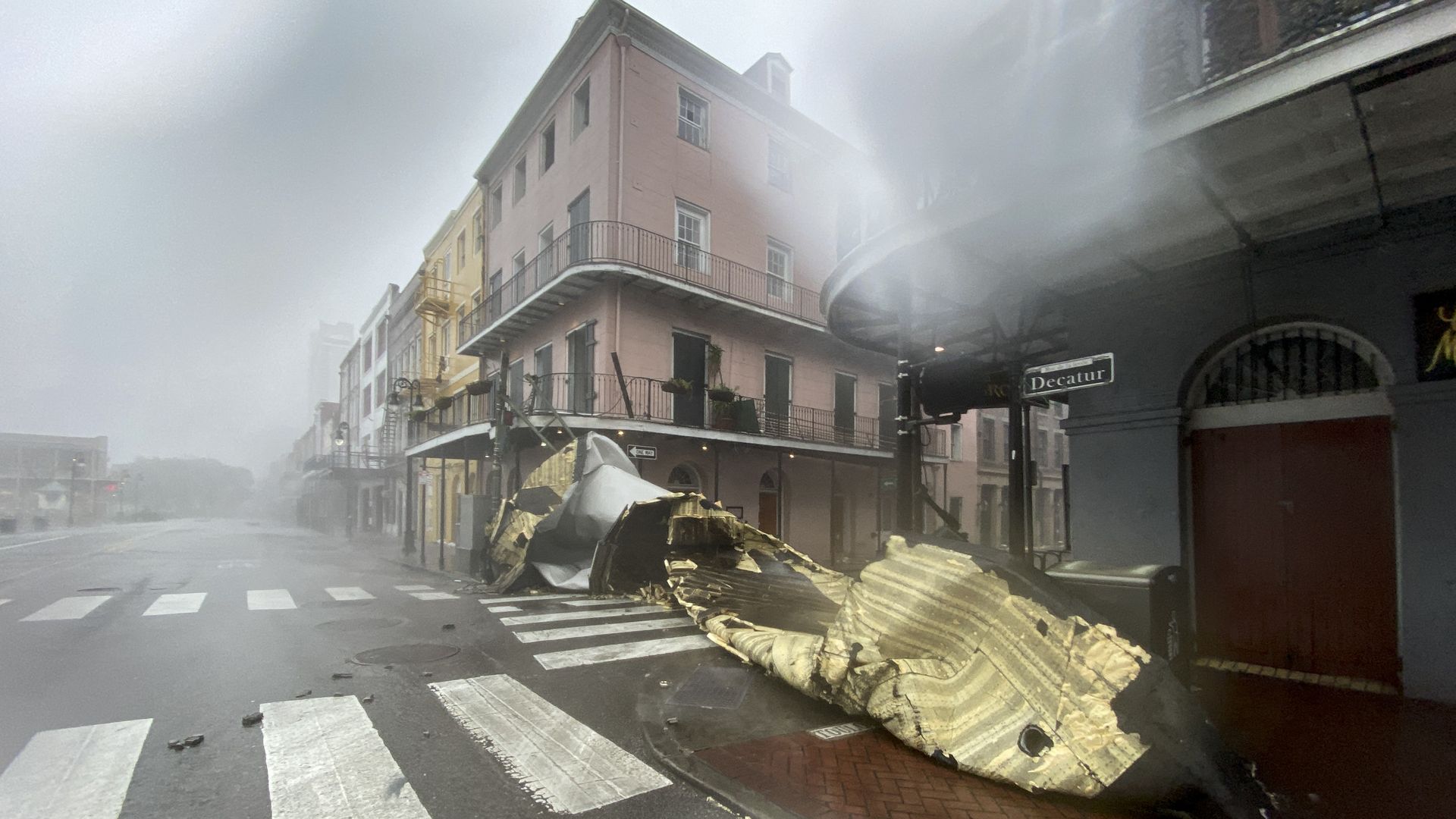 A section of a building's roof is seen after being blown off during rain and winds in the French Quarter of New Orleans, Louisiana