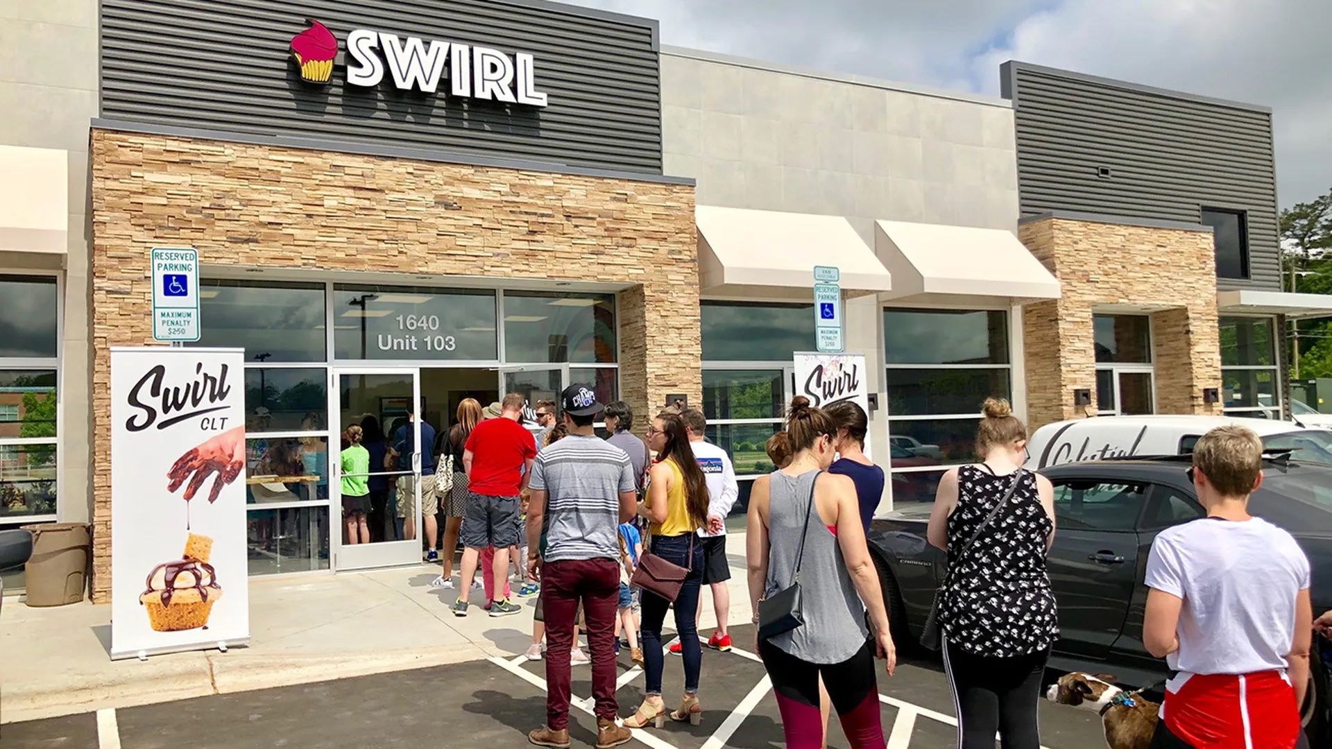 lines out the door of a shop called swirl