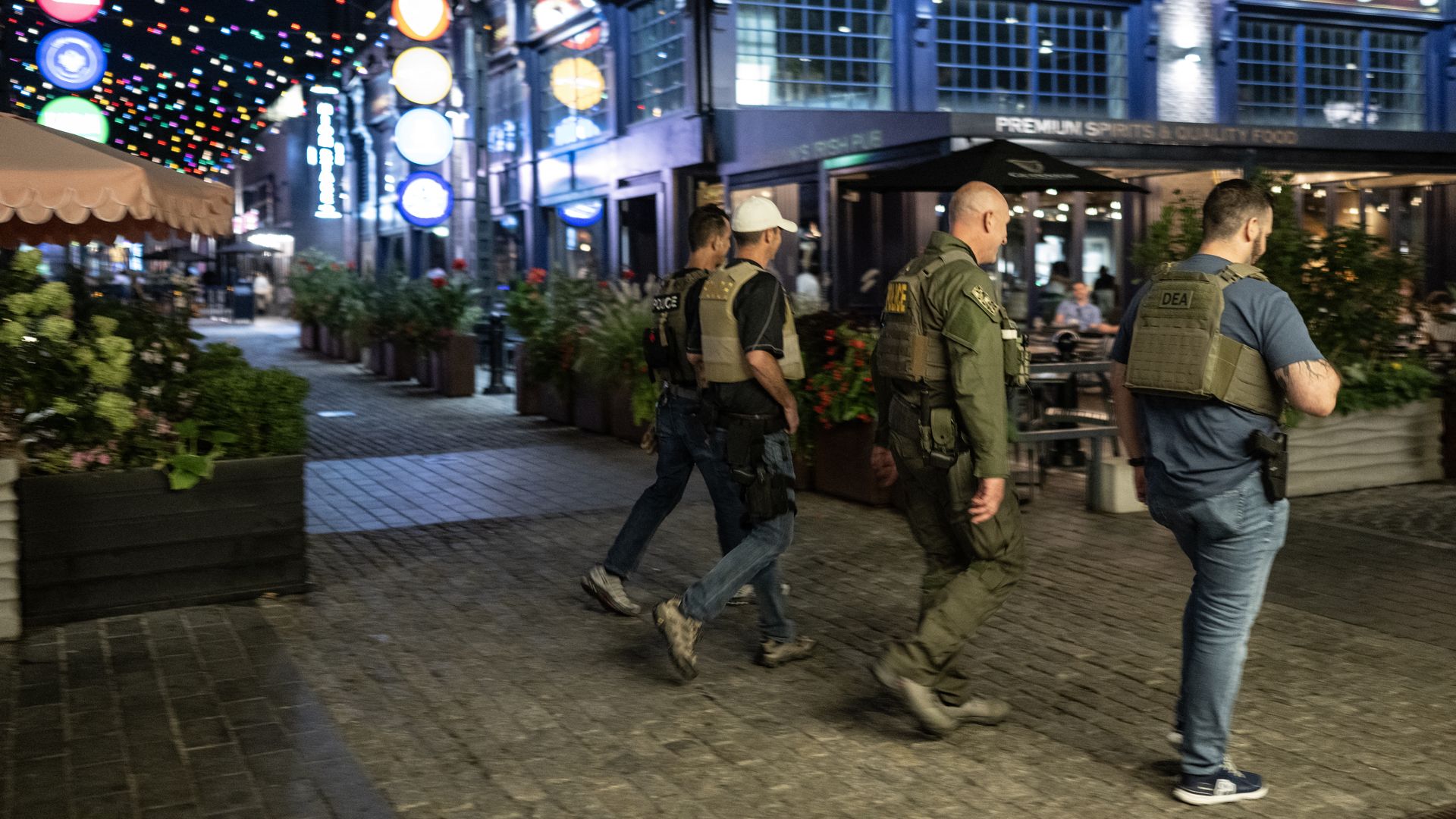 Federal agents patrol a street in The Wharf waterfront neighborhood in Washington, DC on August 11, 2025. 