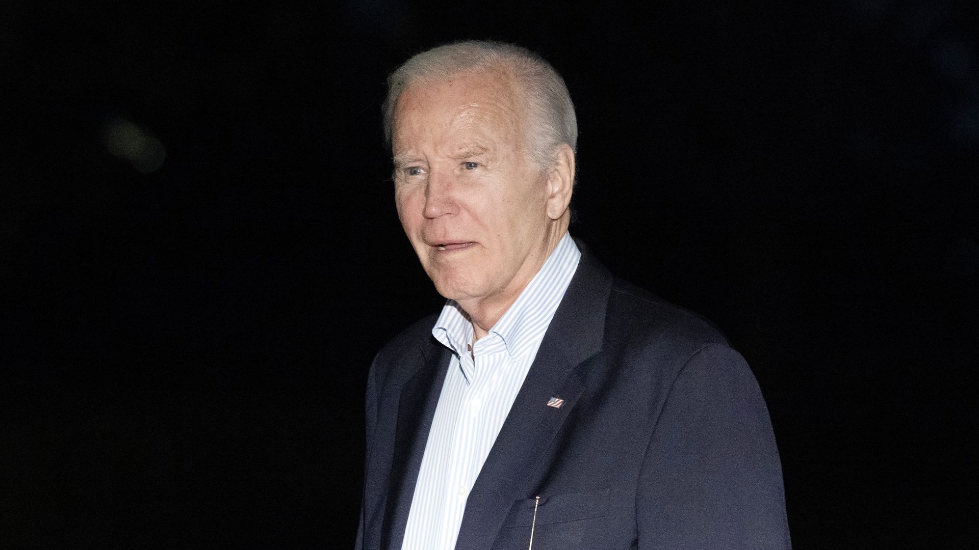 President Biden is shown wearing a blue blazer and a collared shirt.