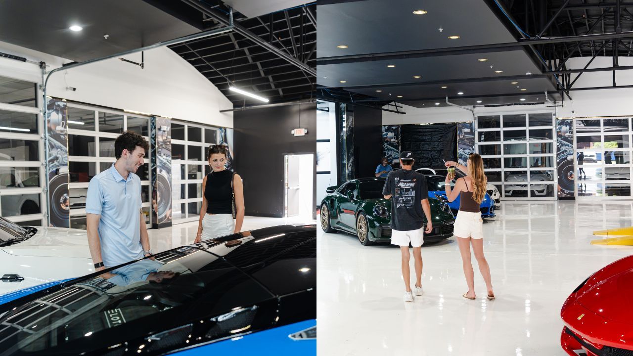 Cars in AutoLab Caffeena Charlotte. Inside a bright car showroom with a white glossy floor, four people admire and photograph glossy sports cars, including a black car in the foreground and a green car in the center.