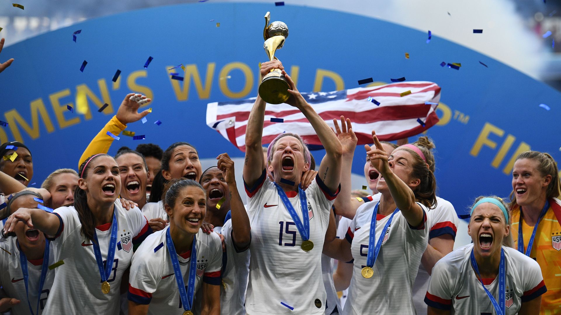 USA's players including forward Megan Rapinoe (C) celebrate with the trophy after the France 2019 Womens World Cup football final match between USA and the Netherlands, on July 7.