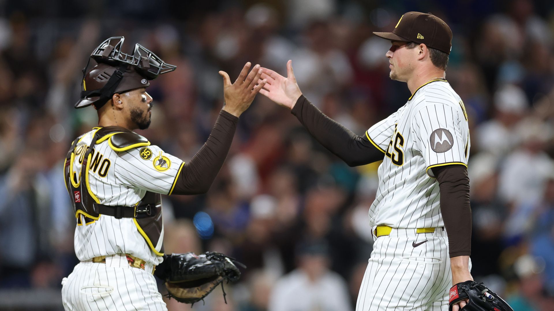 SAN DIEGO, CALIFORNIA - APRIL 16: Luis Campusano #12 celebrates with Mason Miller #22 of the San Diego Padres after defeating the Seattle Mariners 5-2 at Petco Park on April 16, 2026 in San Diego, California. (Photo by Sean M. Haffey/Getty Images)