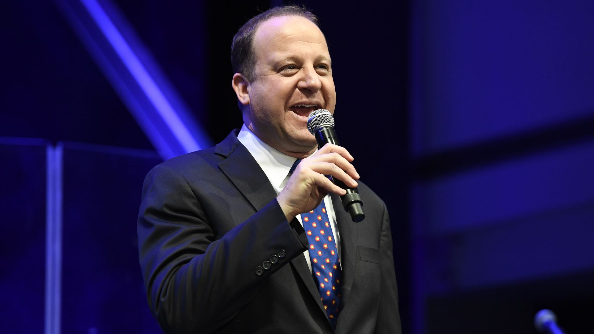 Gov. Jared Polis' on stage during his inaugural ball in 2019. Photo: Andy Cross/The Denver Post via Getty Images