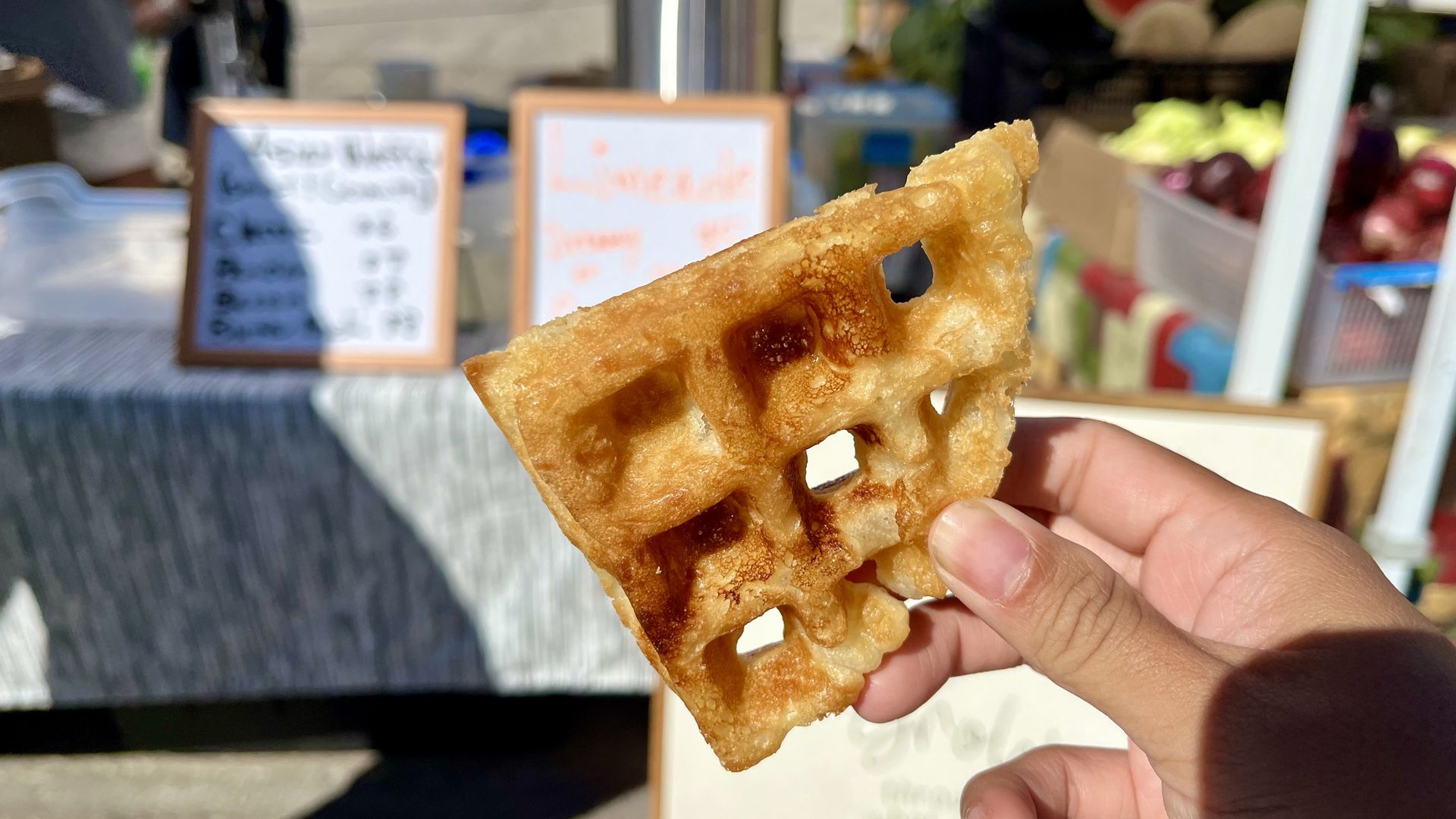 linh holding a quarter of a waffle