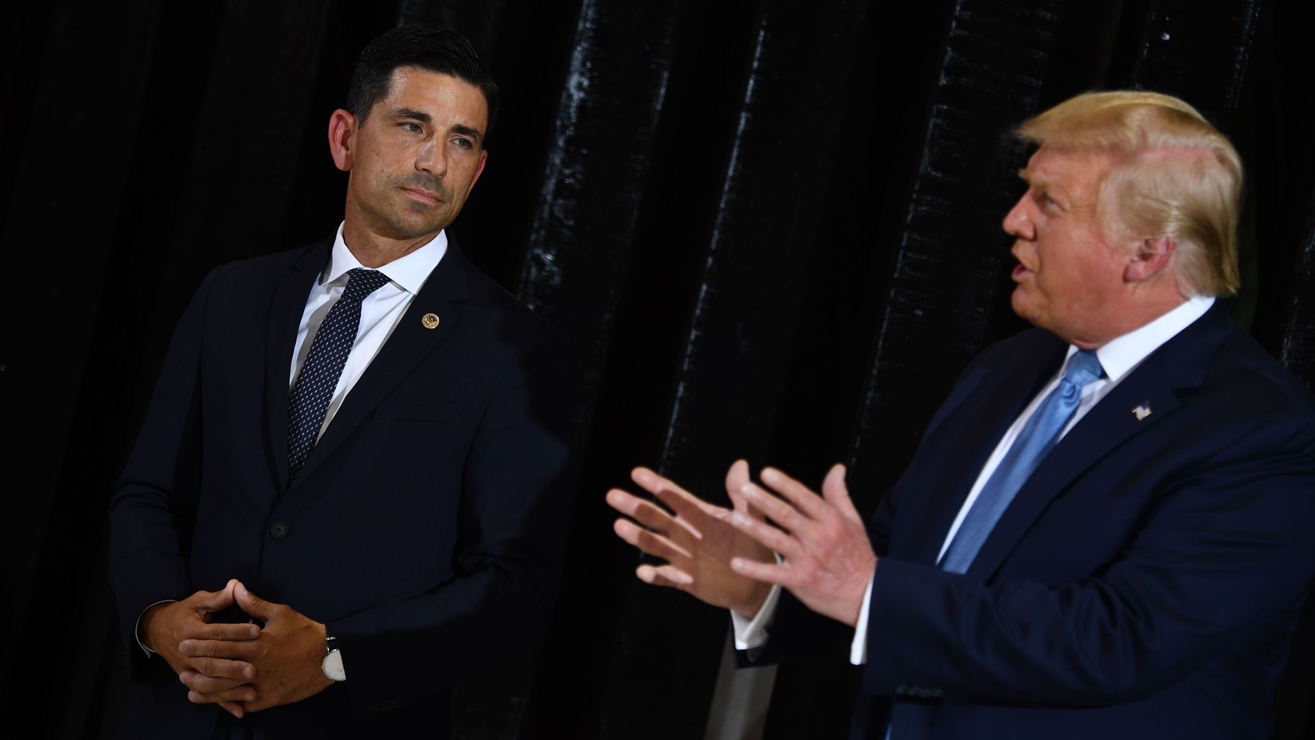 Chad Wolf and Donald Trump.