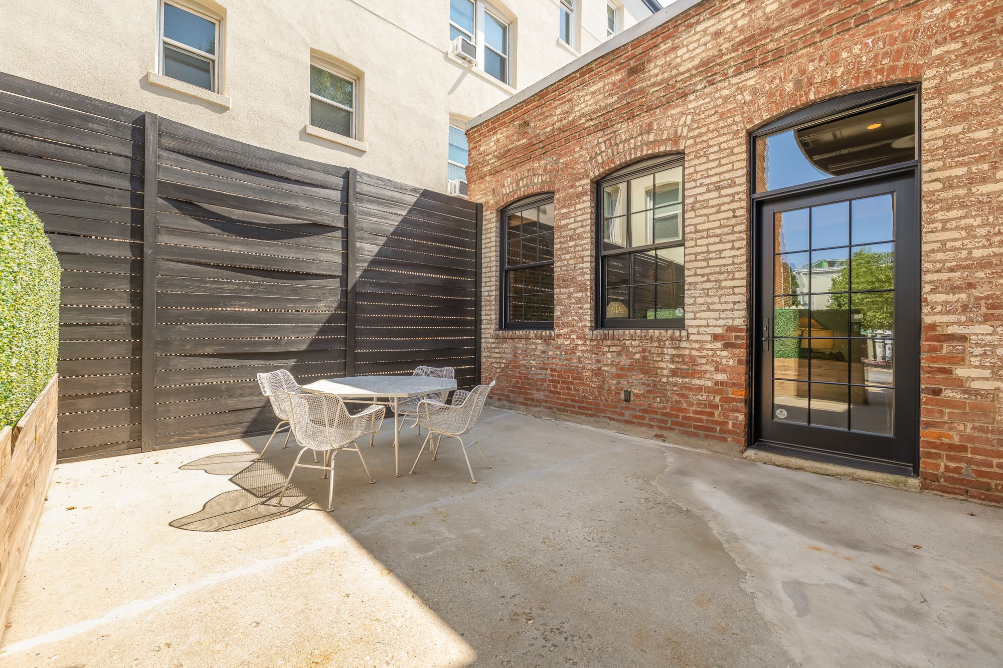A patio connected to the brick exterior of a building.