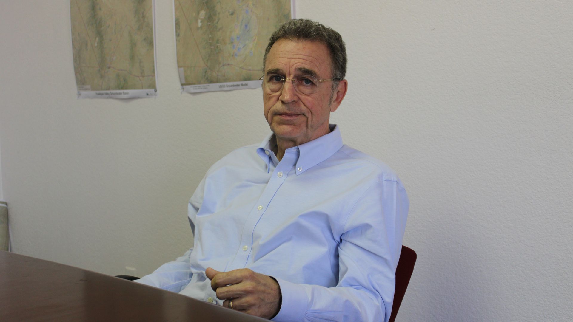 Republican gubernatorial candidate Matt Salmon sits at a table during an interview