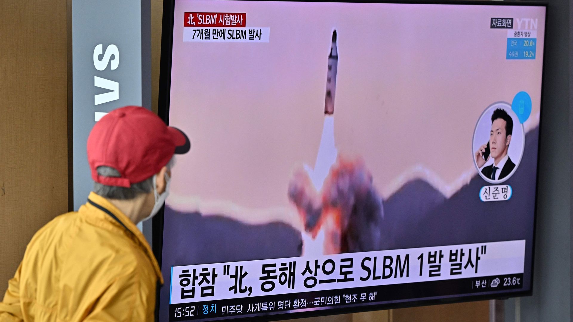 People at a railway station in Seoul on May 7 watching a news broadcast showing file footage of a North Korean missile test.