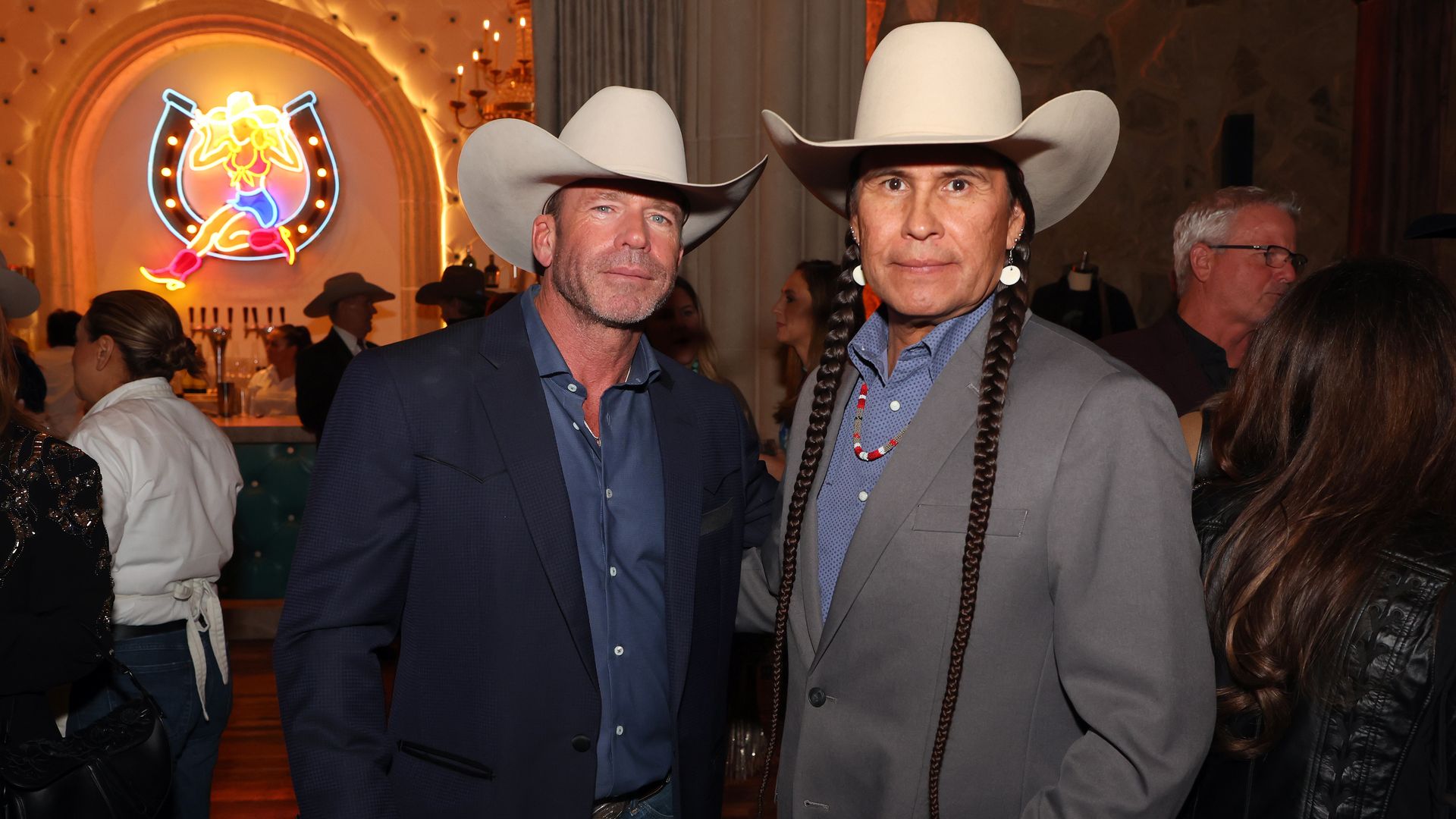 Director Taylor Sheridan and actor Mo Brings Plenty pose for a picture at a hotel in Fort Worth 
