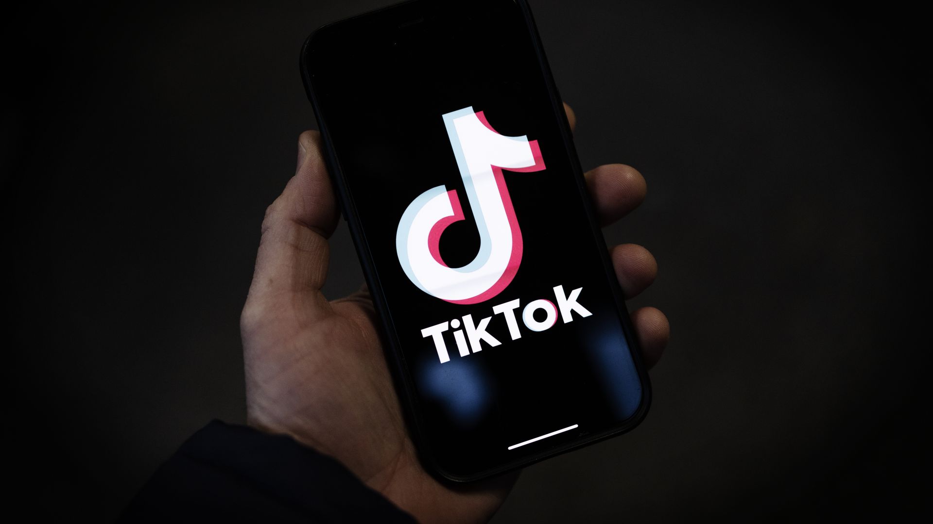 TikTok logo on a phone screen.